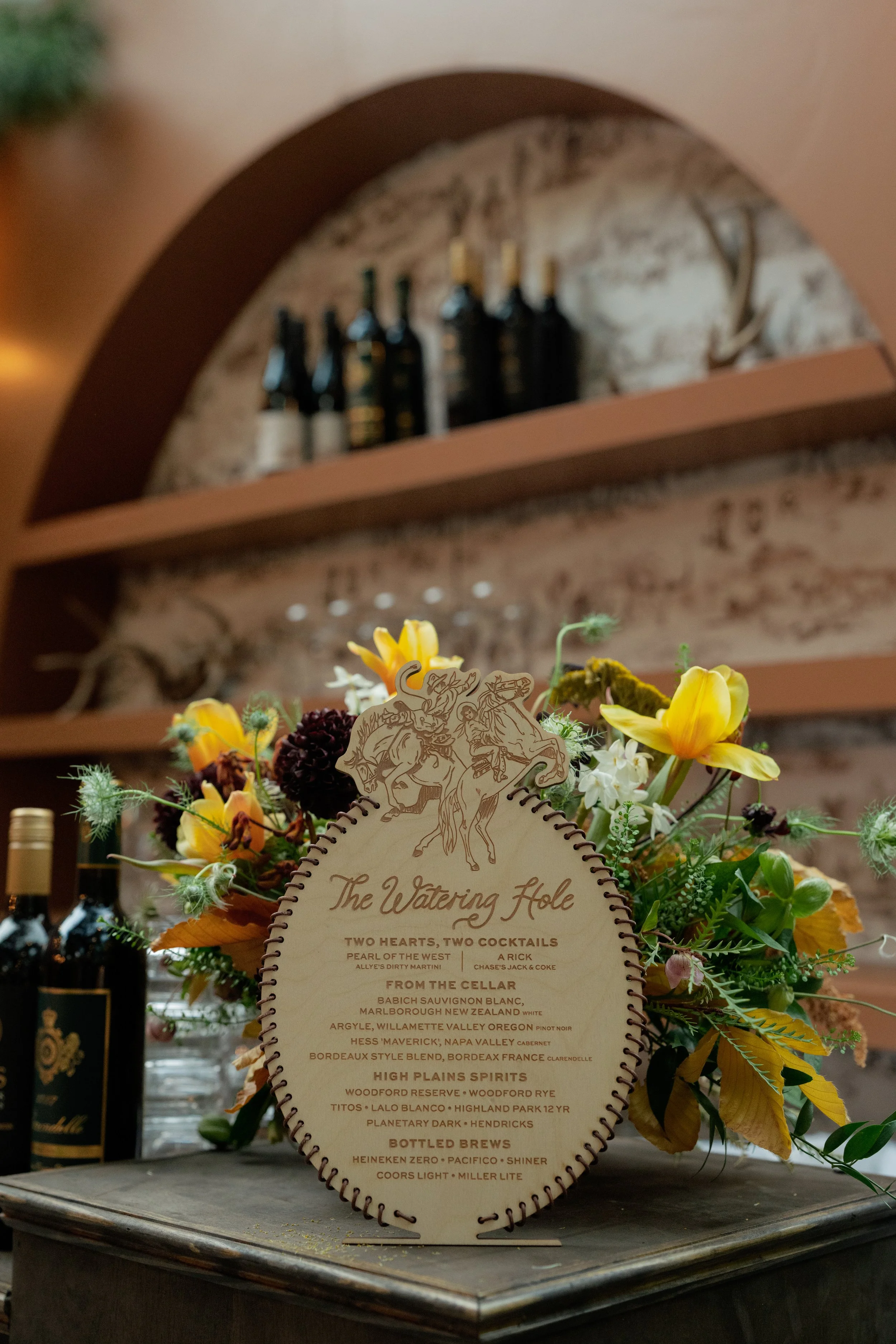 Oval Wood Bar Sign with Cowboy and Cowgirl on Horse with Leather Cord Hand-Tied to Edge for Fort Worth Stockyards Western Wedding