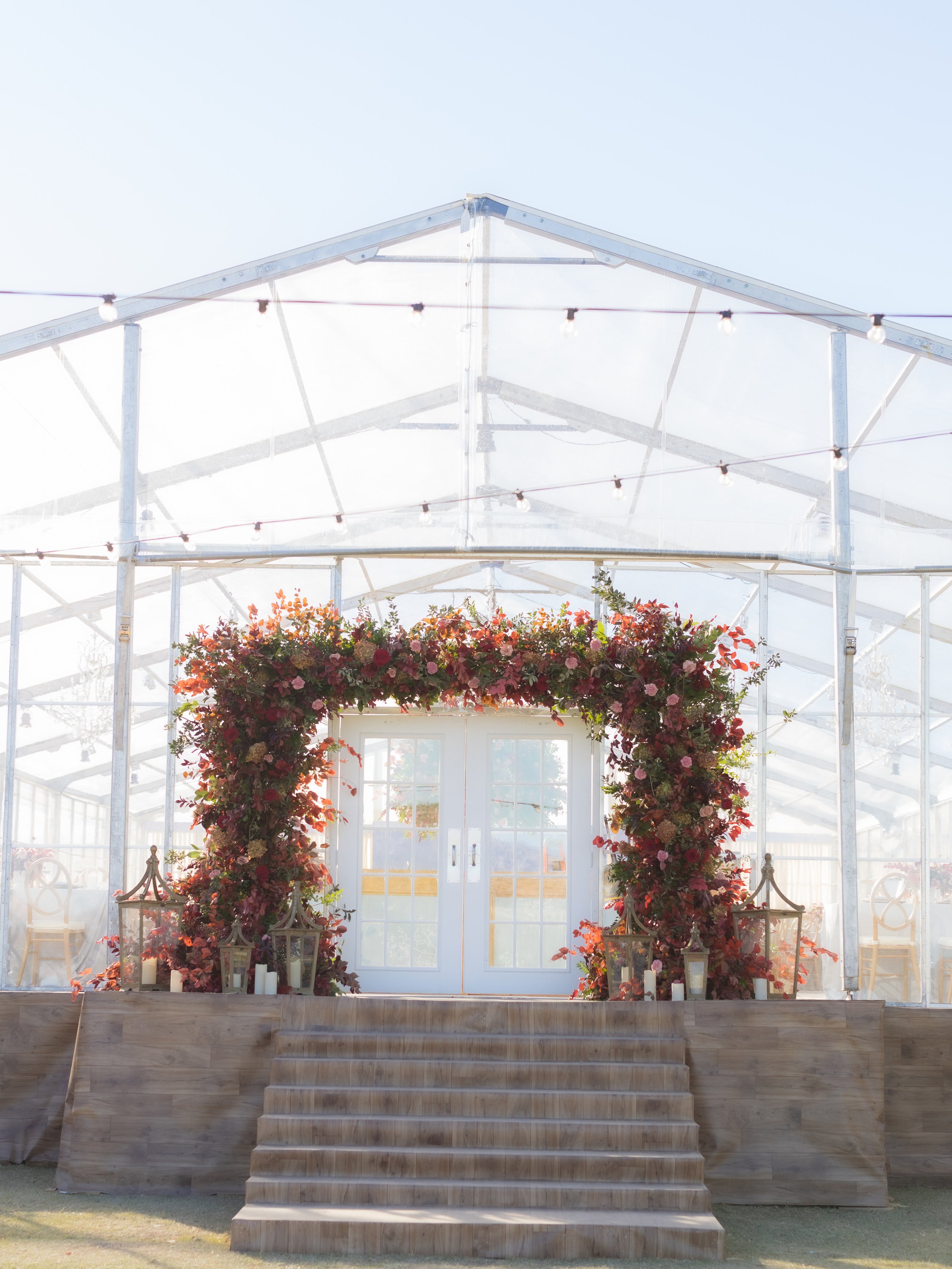 Clear Top Tent Private Estate Ranch Wedding Reception Entrance with Red and Burgundy Florals