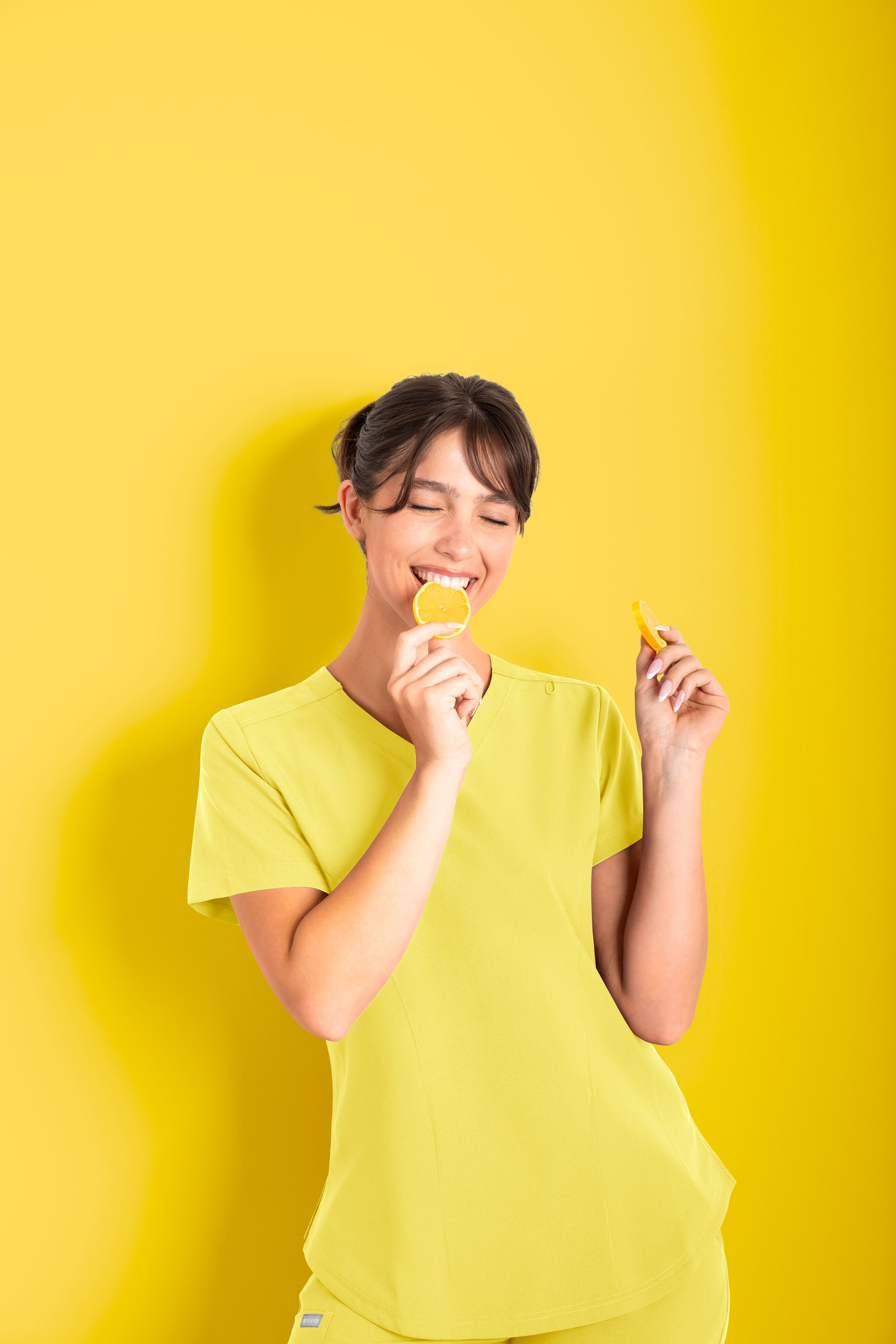 Girl wearing bright yellow scrubs