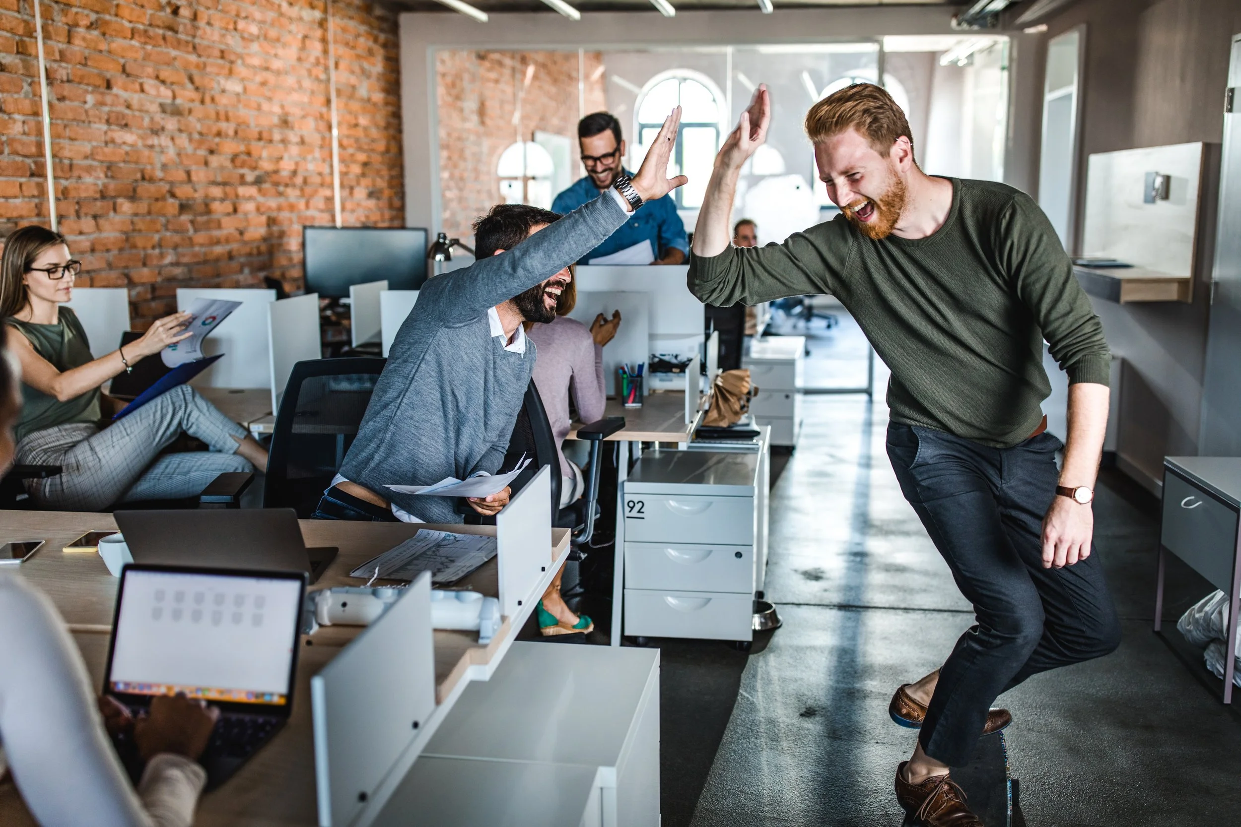 Two guys high-fiving