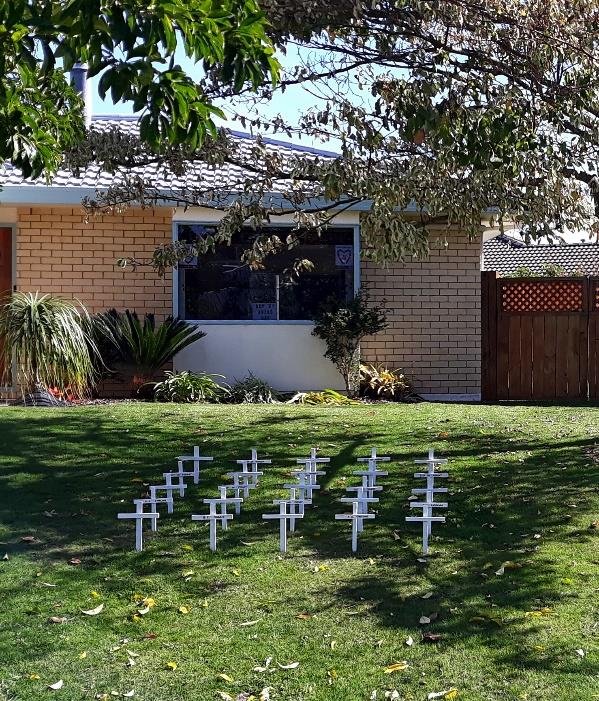 The people next to us had made 25 white crosses and lined them up on their front lawn, some with names of relatives. Everyone had poppies on their front gates and fences and one neighbour wore his grandfather's, his father's and his own medals. Some