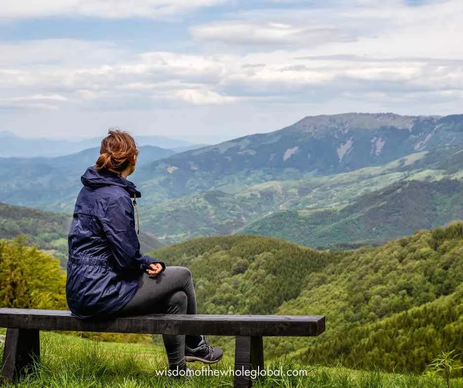 Woman overlooking rolling gren hills