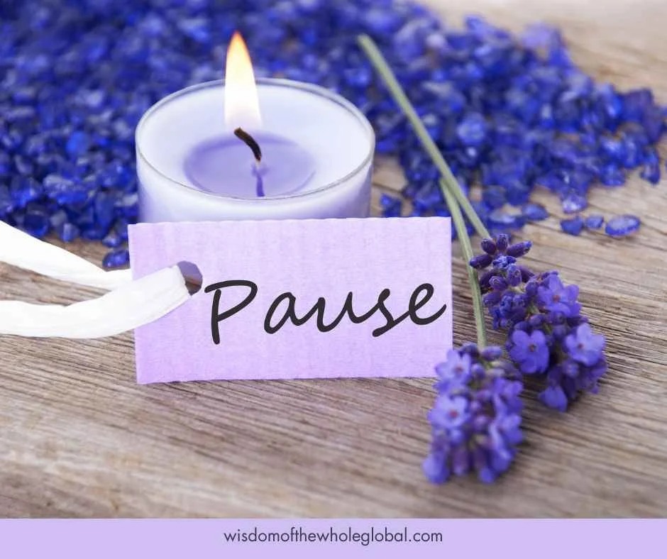 image of flowers a candle and the word pause on a tag