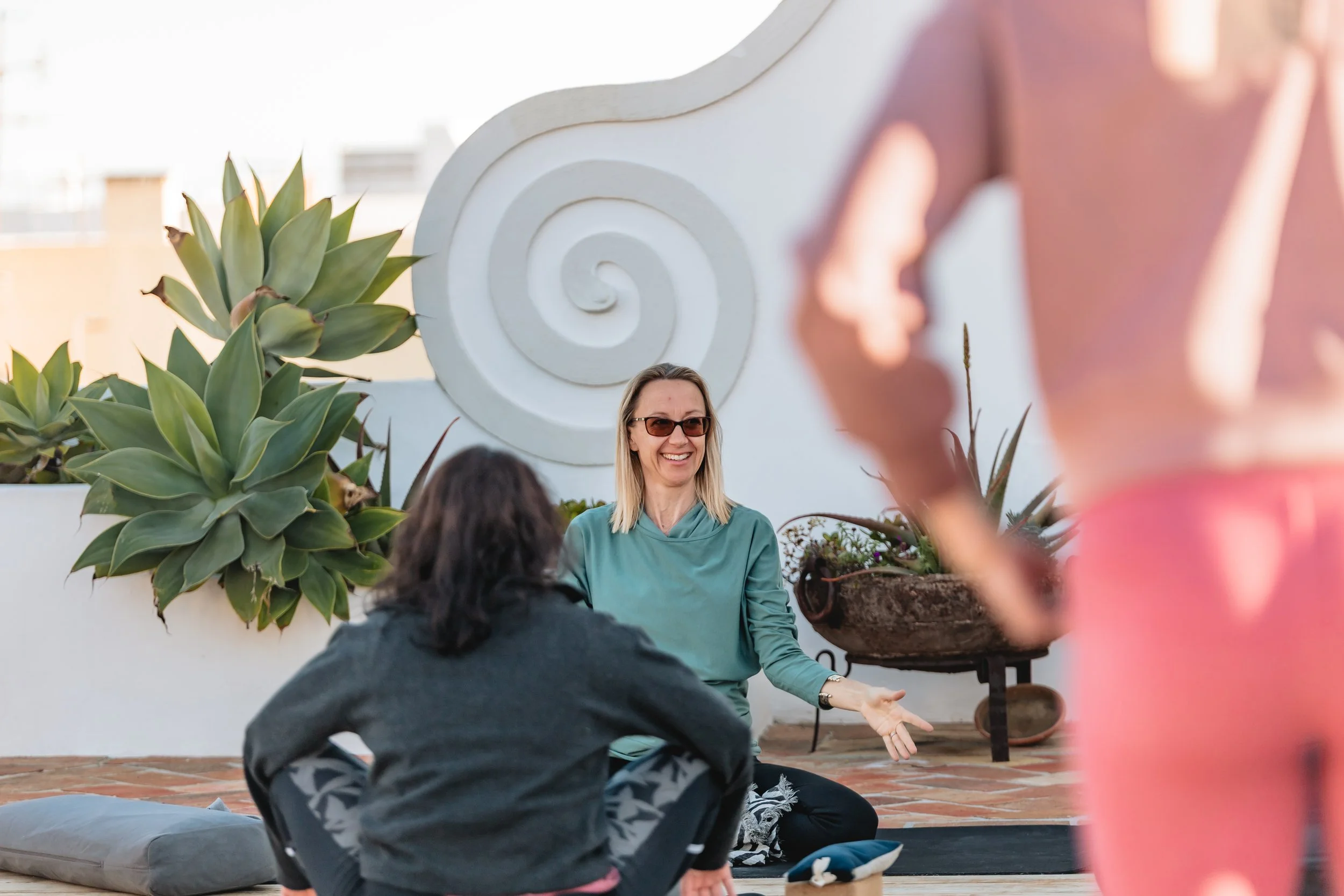 Mandy Brinkley teaching a Yoga Workshop outside in Portugal