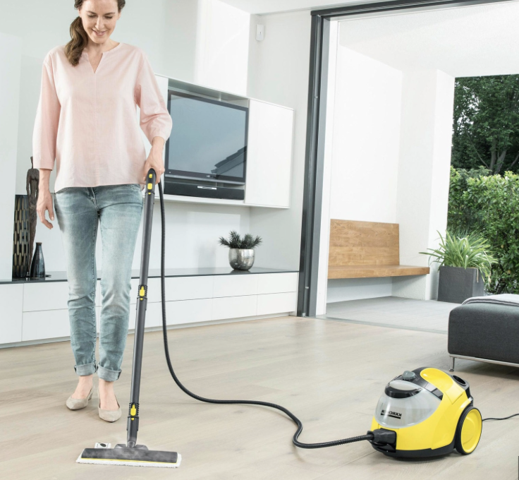 person cleaning using a steam mop