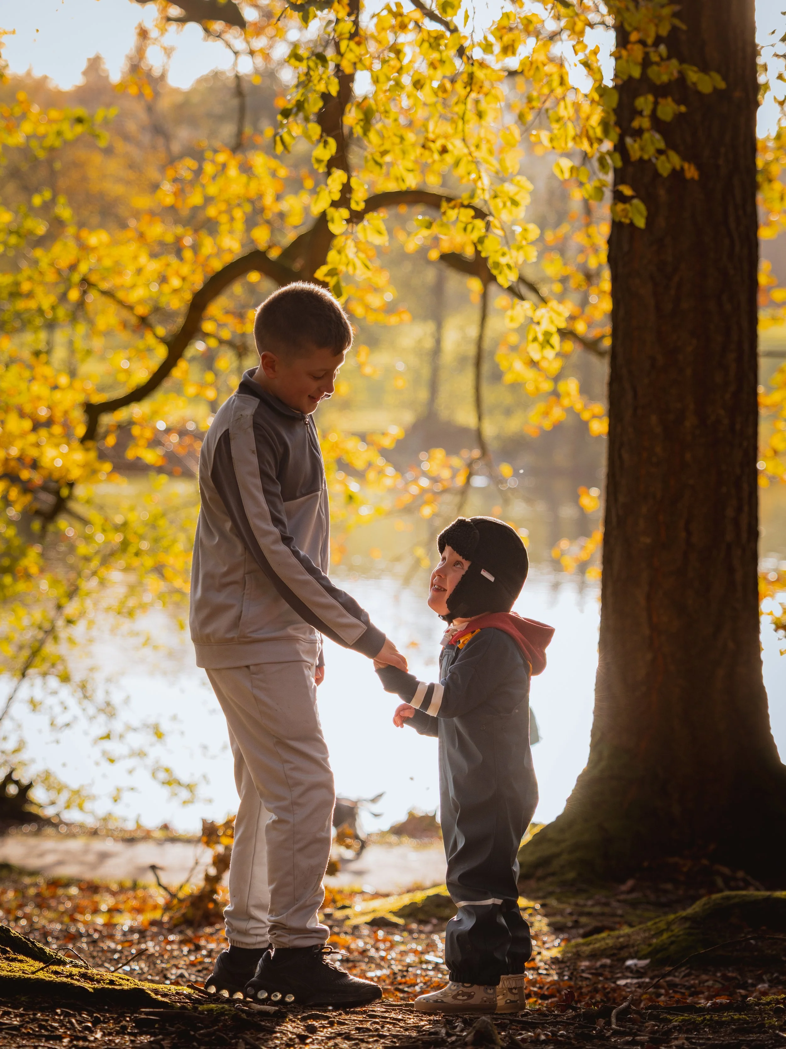 a golden hour moment, 2 cousins enjoying a walk through the forests in hillsborough castle