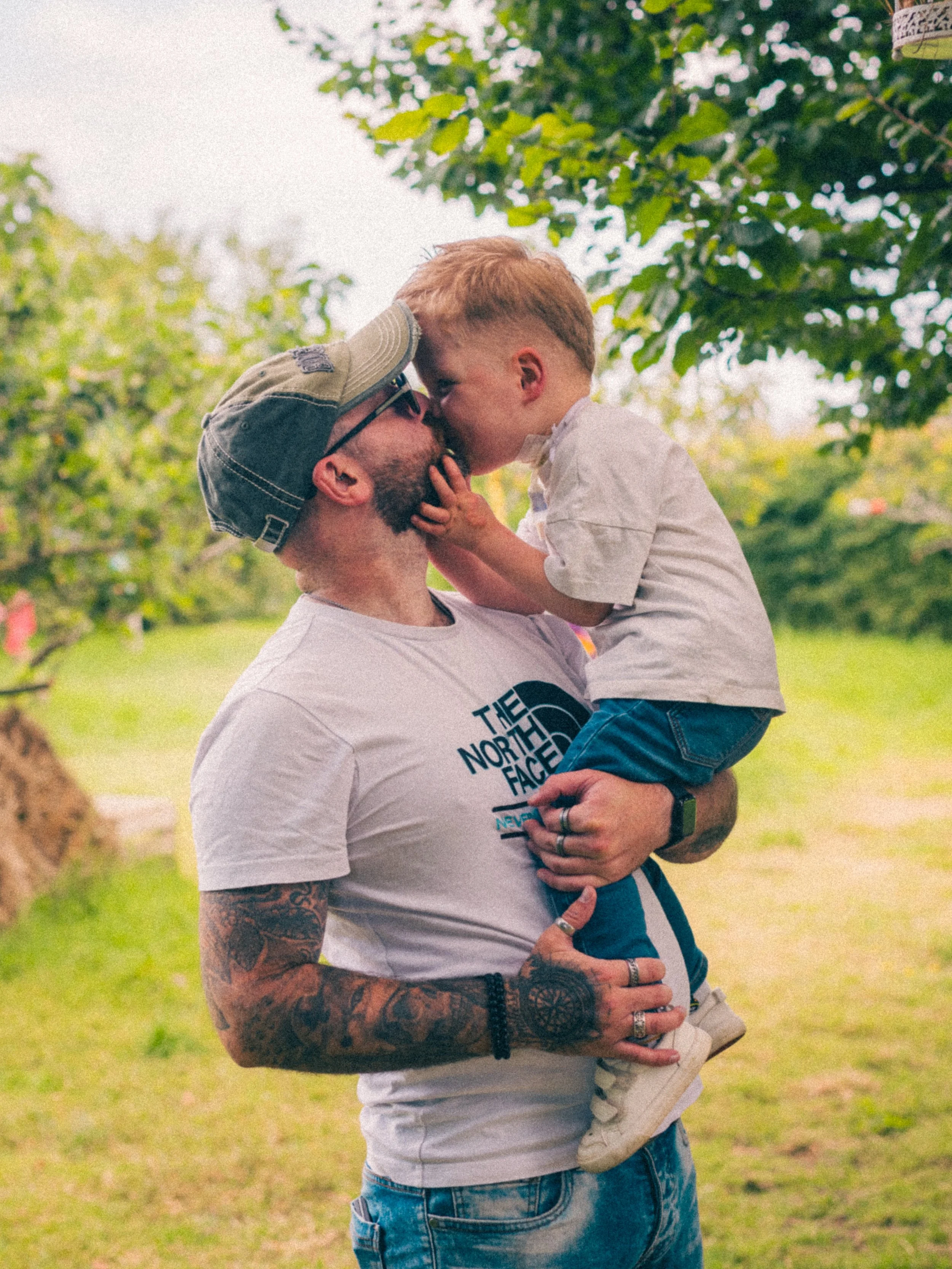 a father and son moment, captured in the sunflower fields in donaghadee, county down