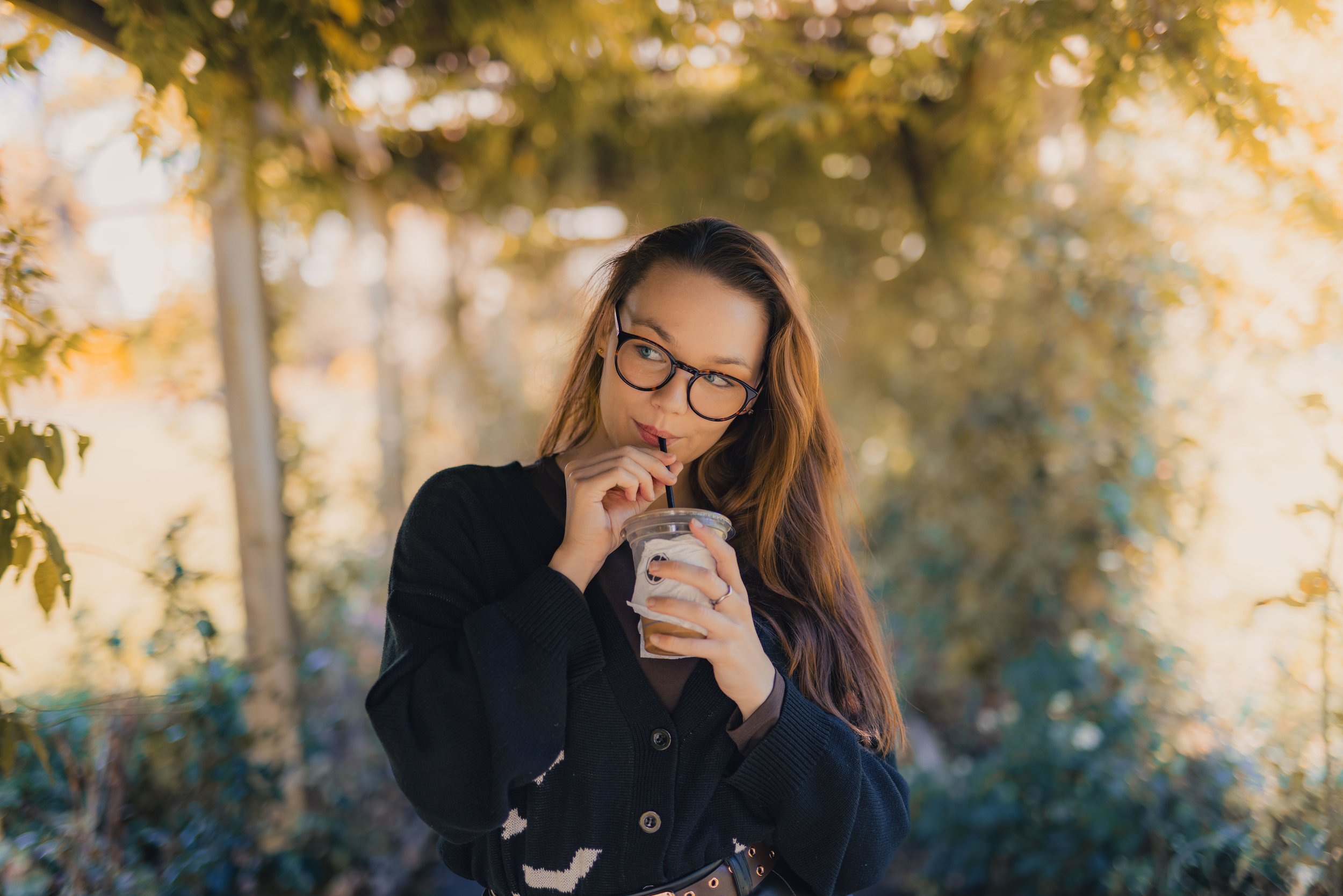 influencer enjoying a coffee in the flower arches in ward park, Bangor Co.Down Northern Ireland
