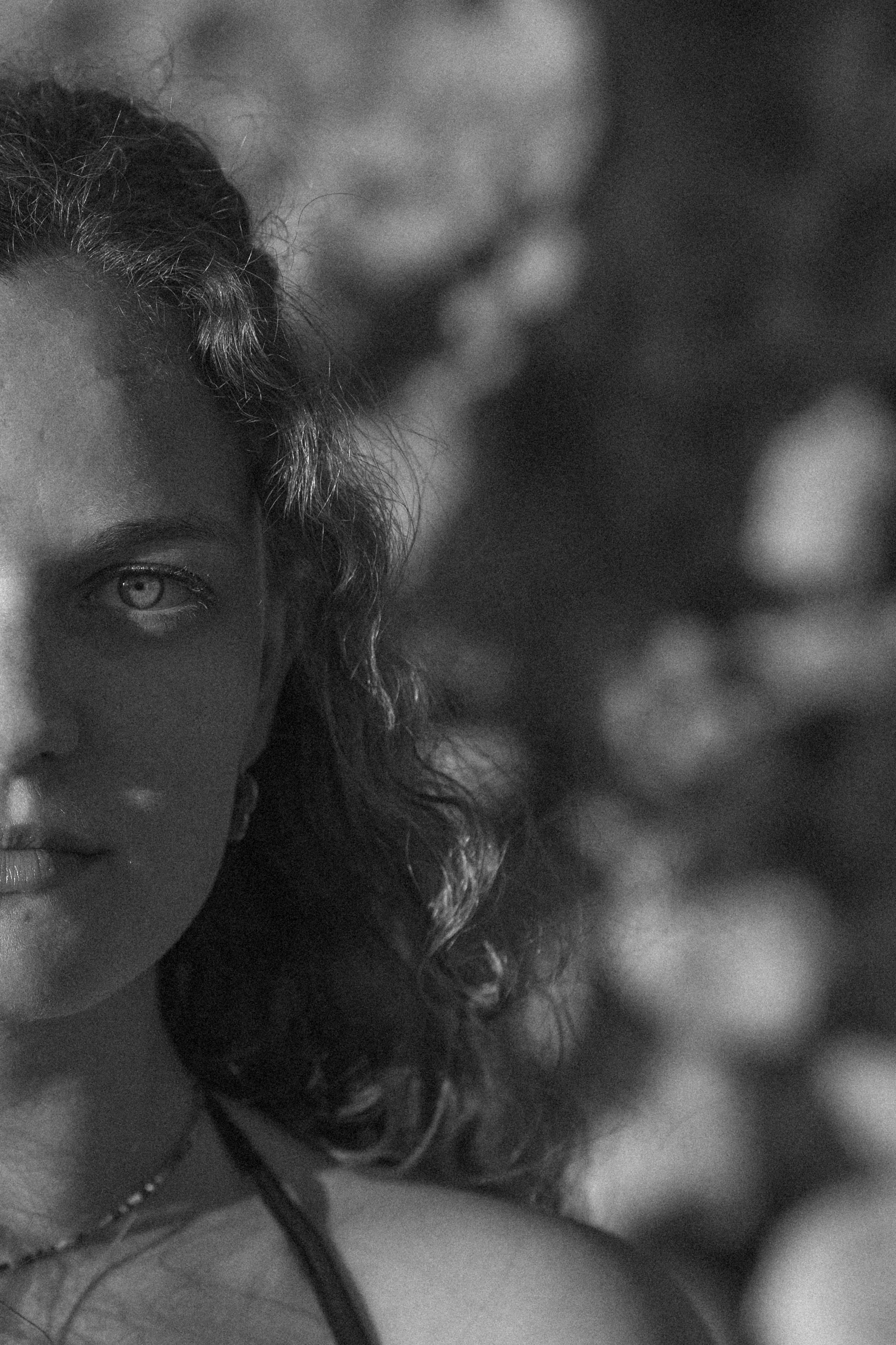 Girl with eye in sunlight black & white close-up