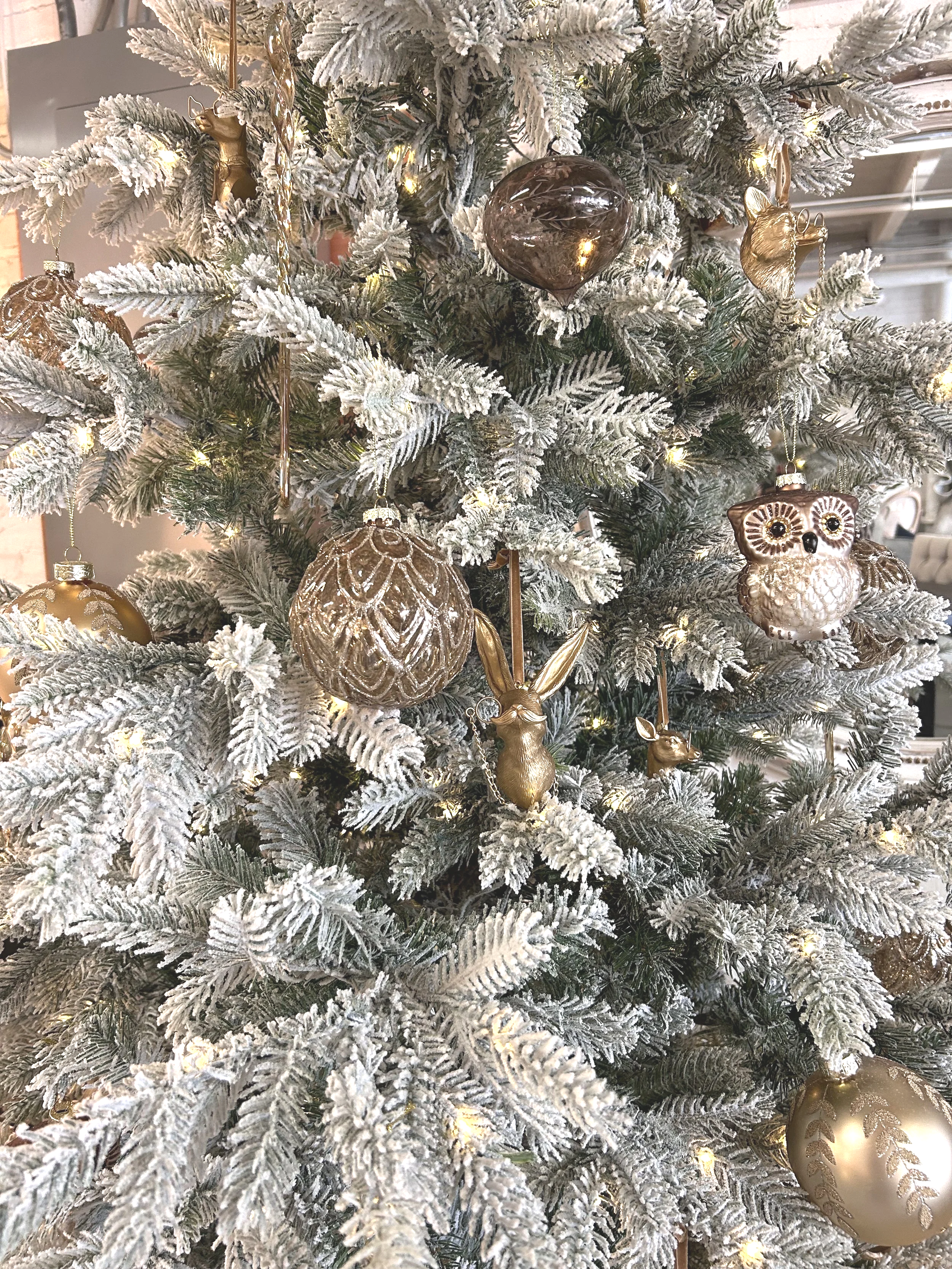 The holiday tree in the warehouse is filled with unique and gift-worth holiday ornaments, including the Eric & Olivia animal busts.