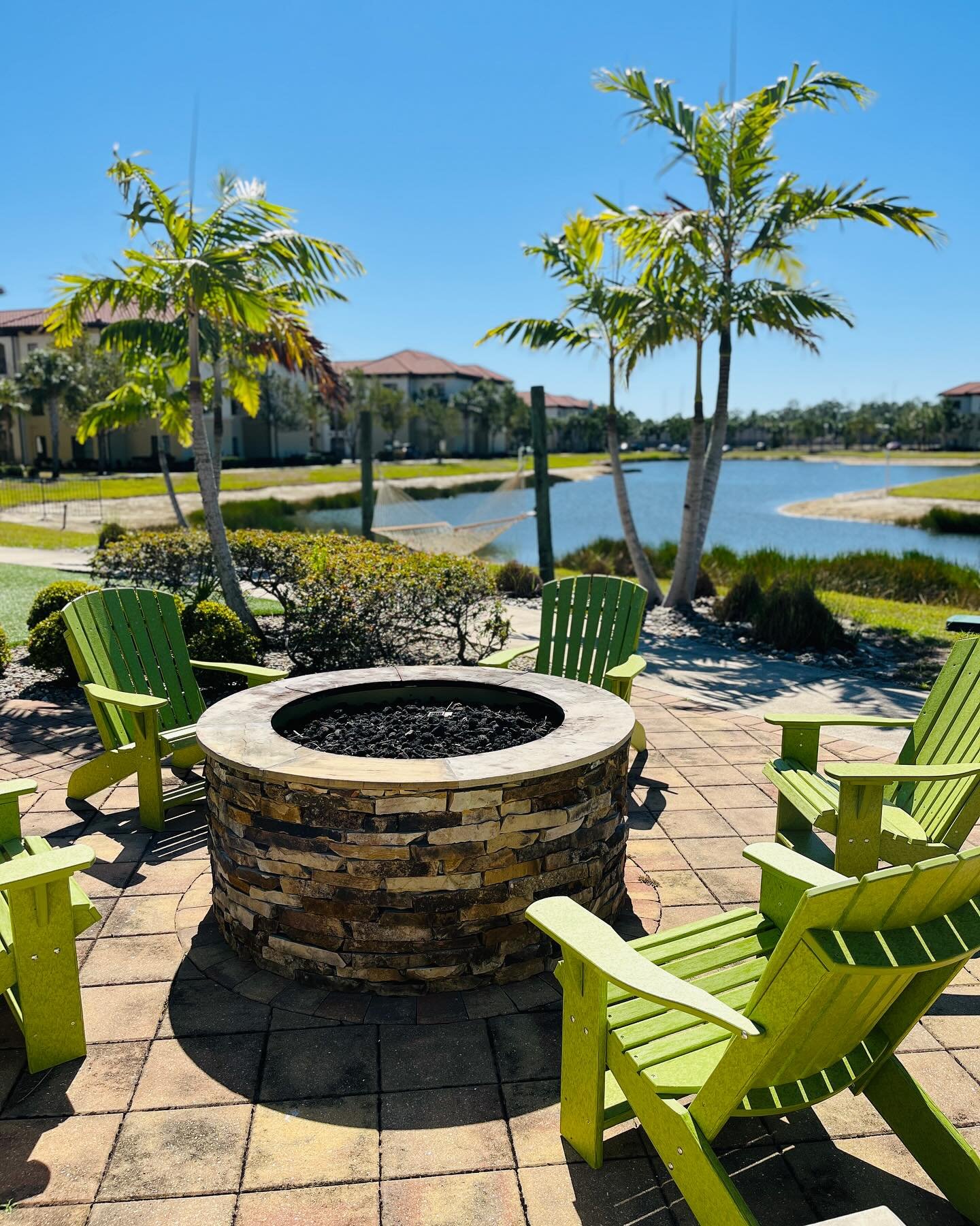 When the fire pit&rsquo;s hot 🔥, the drinks are cold 🥂, and the lake view does all the talking 🌴🌅&hellip; yeah, that&rsquo;s a Reef kind of night.
&bull;
&bull;
&bull;
#TheReefVibes #FloridaViews #LakeLife #PalmTreeParadise #FirepitNights #ChillS