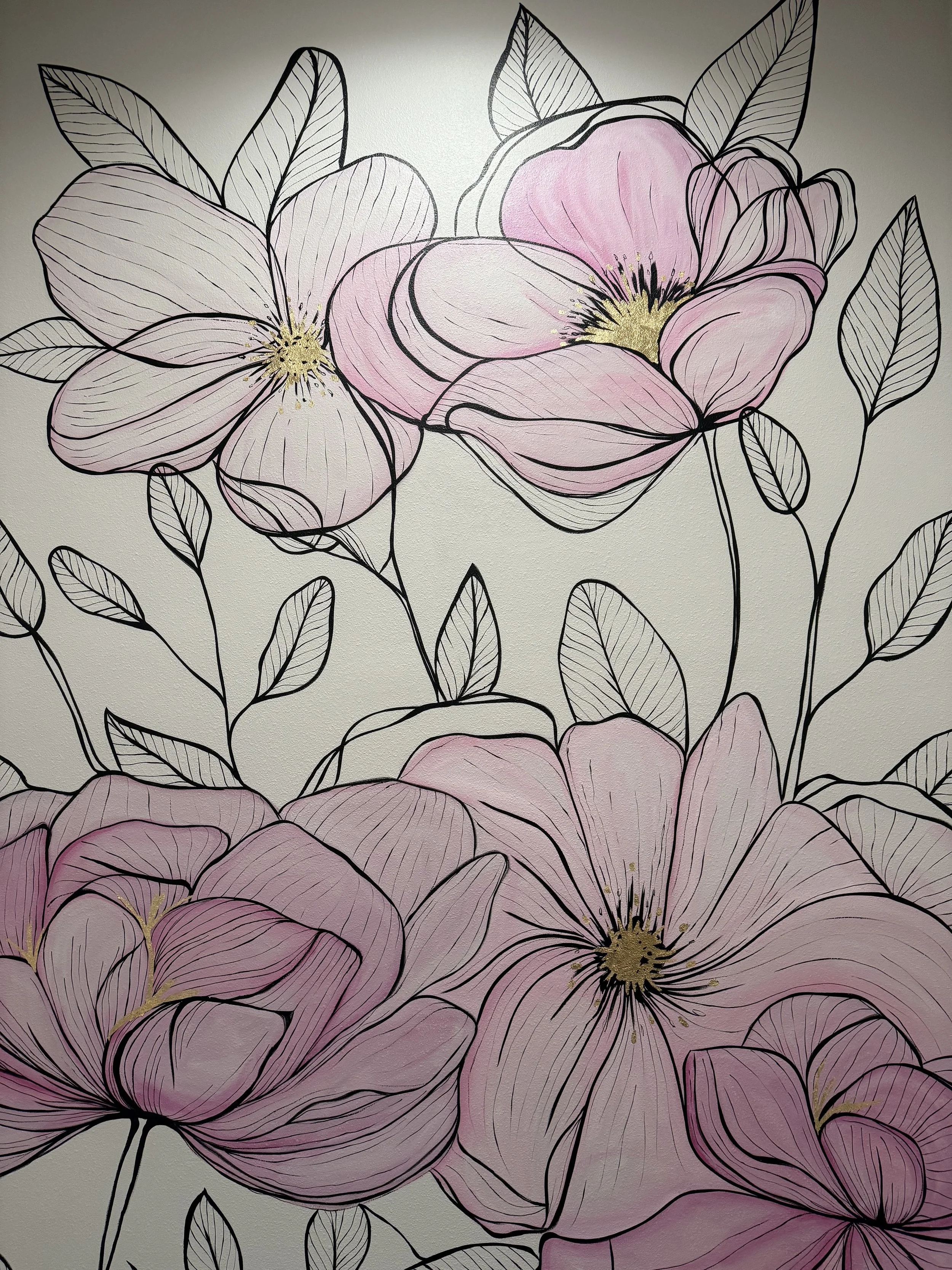 Illustration of large pink and white flowers with black outlines and leaves on a light background.