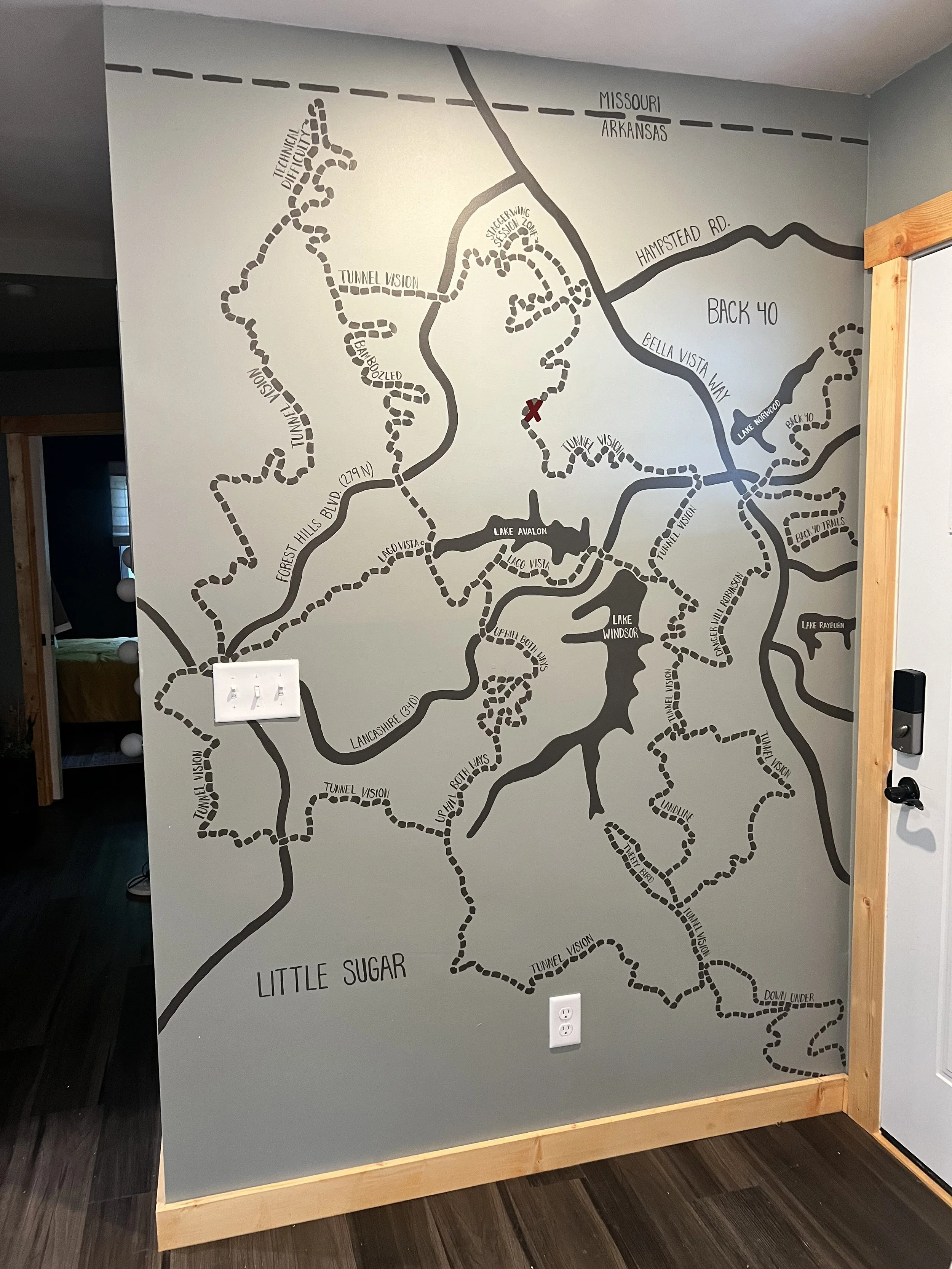Map of hiking trails around Lake Avalon and Little Sugar, including Tunnel Vision, Back 40, and other trail names, with a red X marking a specific location.