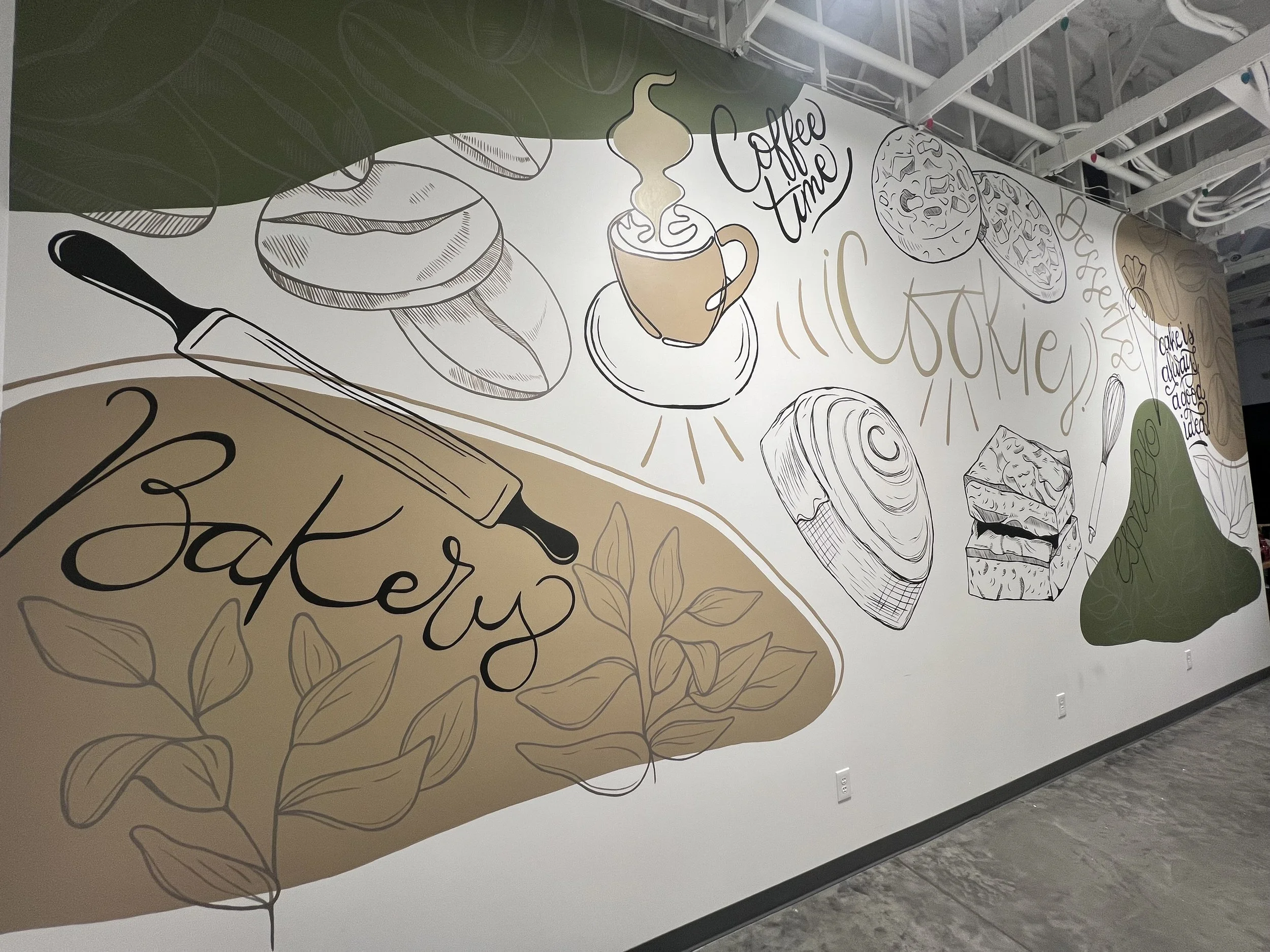Wall mural with baking and coffee illustrations, including a rolling pin labeled 'Bakerly,' a coffee cup with 'Coffee Time,' various baked goods, and decorative text.