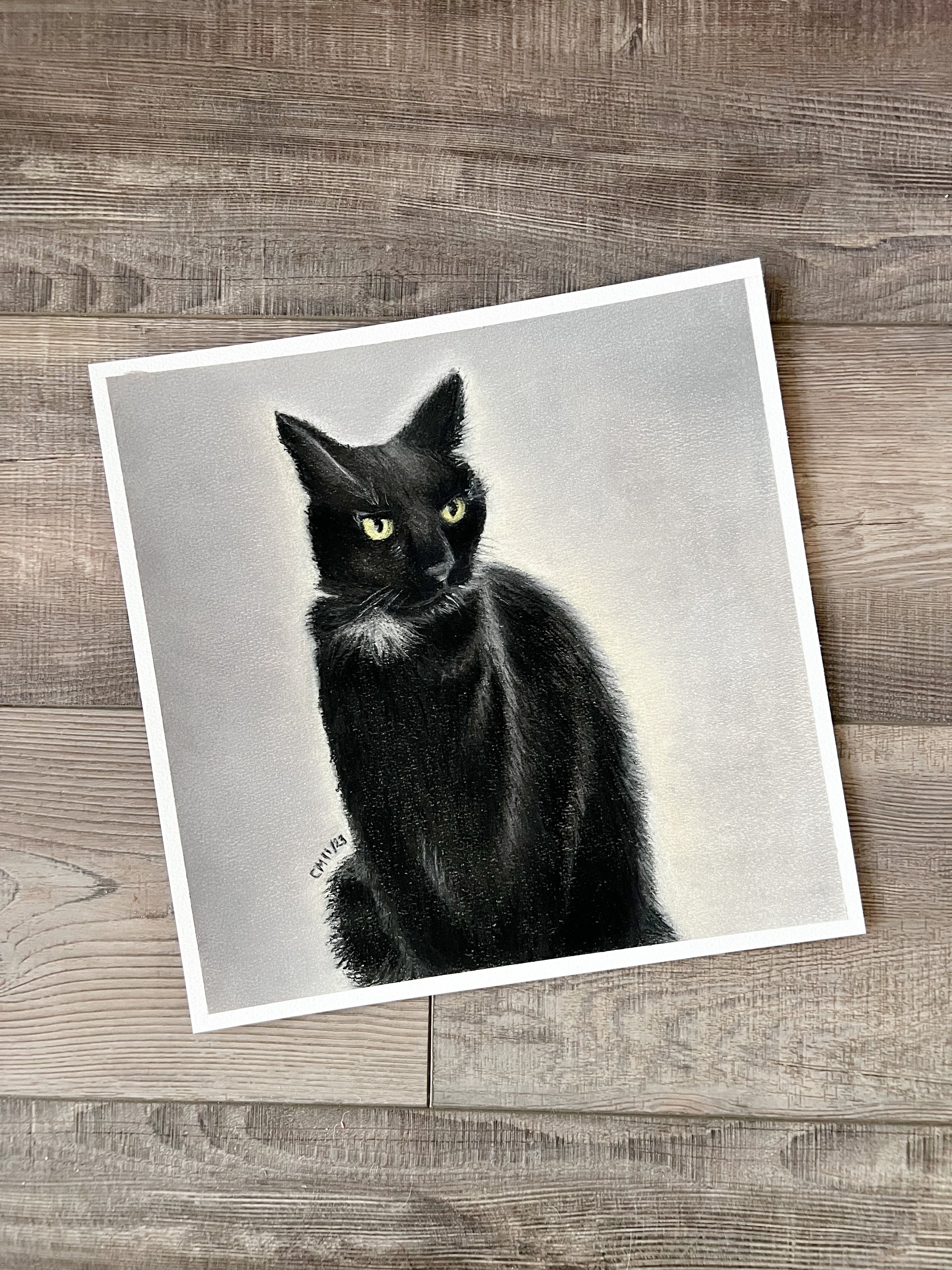 Painting of a black cat with yellow eyes, sitting and looking to the side, on a white background.