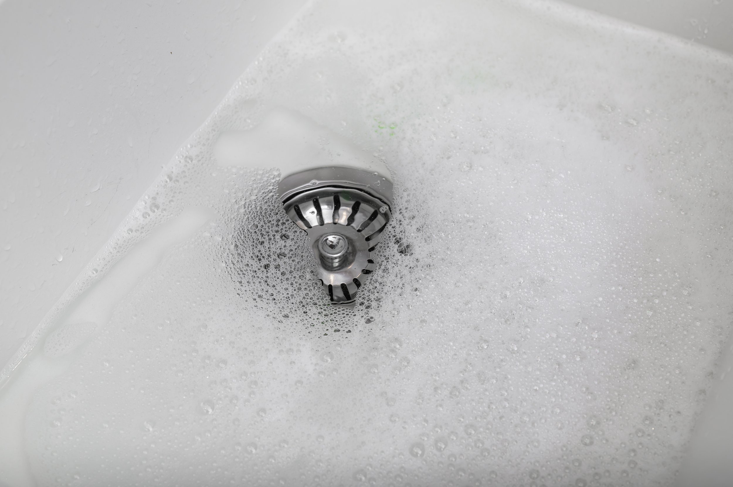 Image of a sink or bathtub draining slowly.