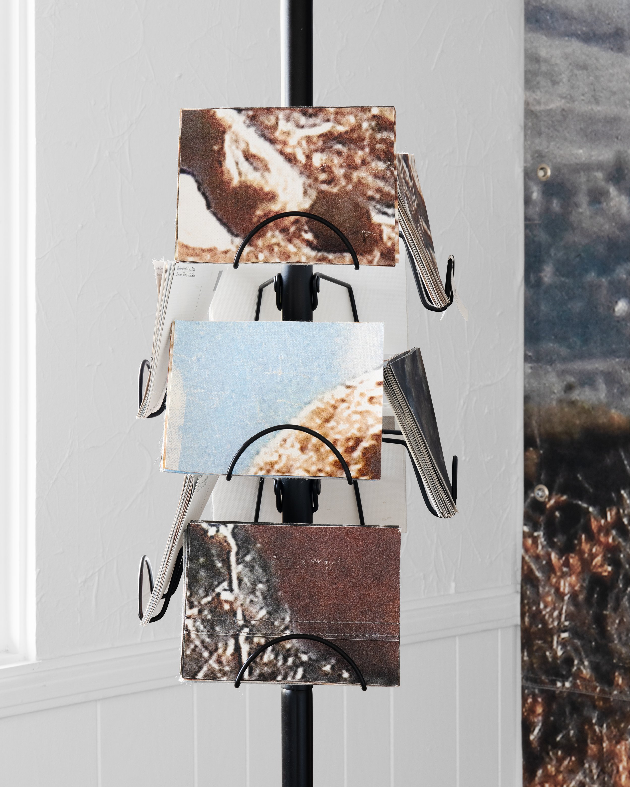 Roman de Salvo and Lizzie Zelter
 Greetings from McCairn , 2024 
Letterpress prints on vinyl salvaged from McCairn, adapted pole lamp mast, steel, hardware 
8 ½ x 1 x 1 ft.