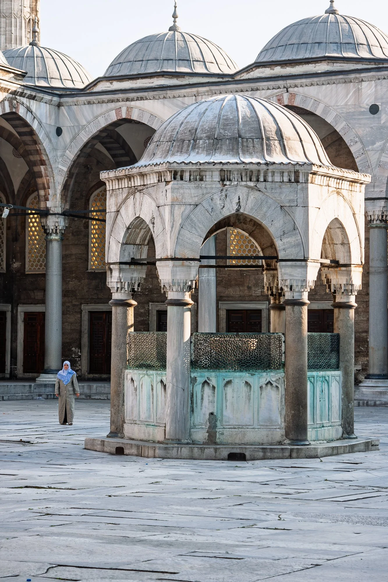 Woman crossing the Blue Mosque courtyard, Istanbul