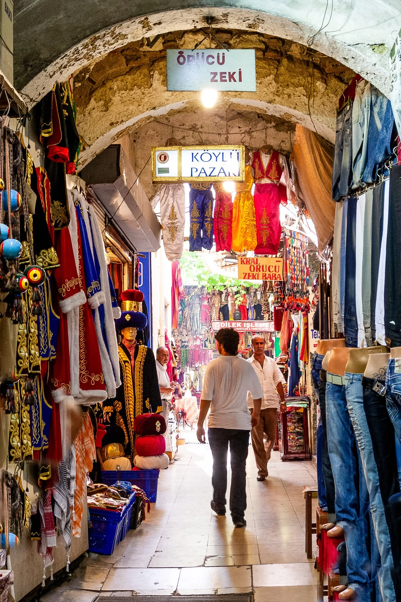 Man walking towards the light down the Köylü Pazarı passage, Grand Bazaar, Istanbul — Canon EOS 40D
