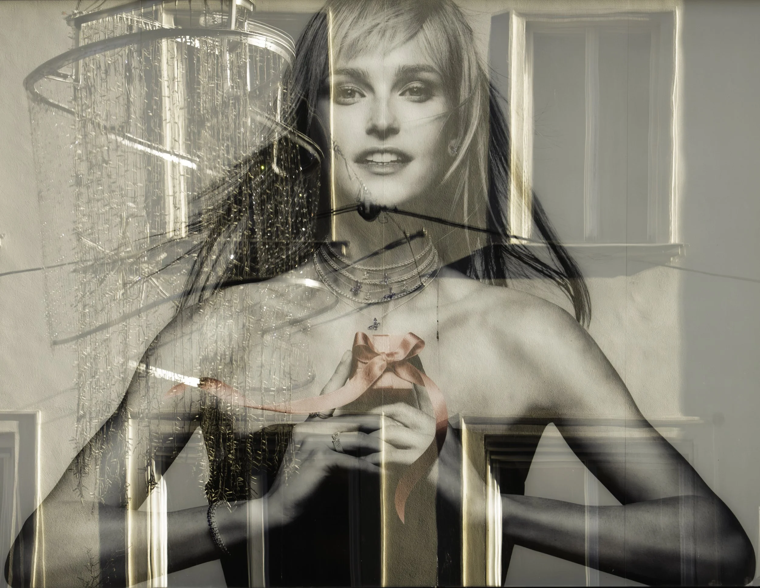 Building and street reflected on an advert of a model that shows her women's perfume. Street photography in Barcelona – bCLPhoto