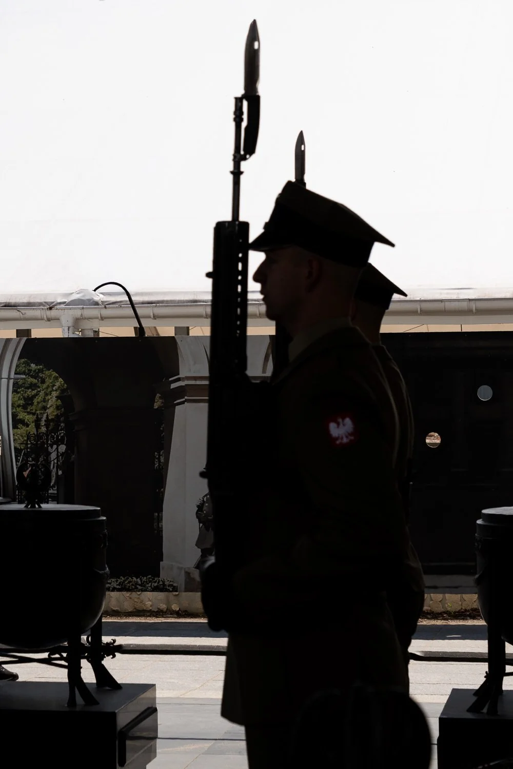 Silhouette of a soldier with a bayoneted rifle under the colonnade, Tomb of the Unknown Soldier, Warsaw — Sony a7R IV