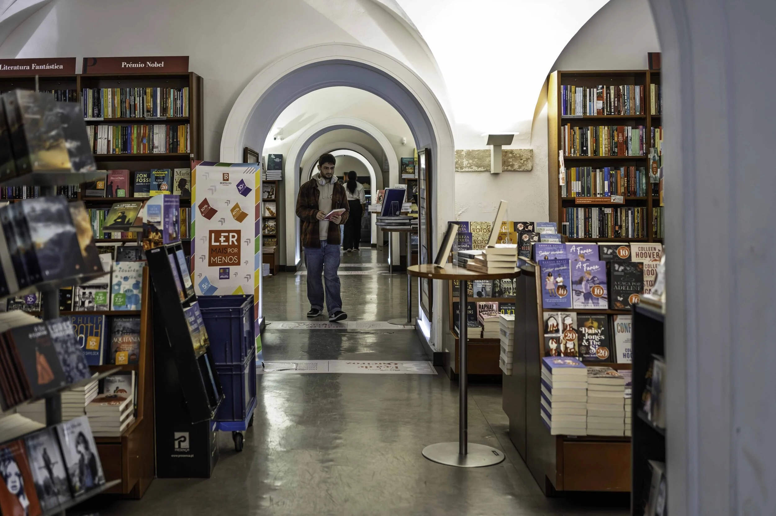 Arched corridor inside Livraria Bertrand, oldest bookshop in the world, Chiado, Lisbon — Leica Q3