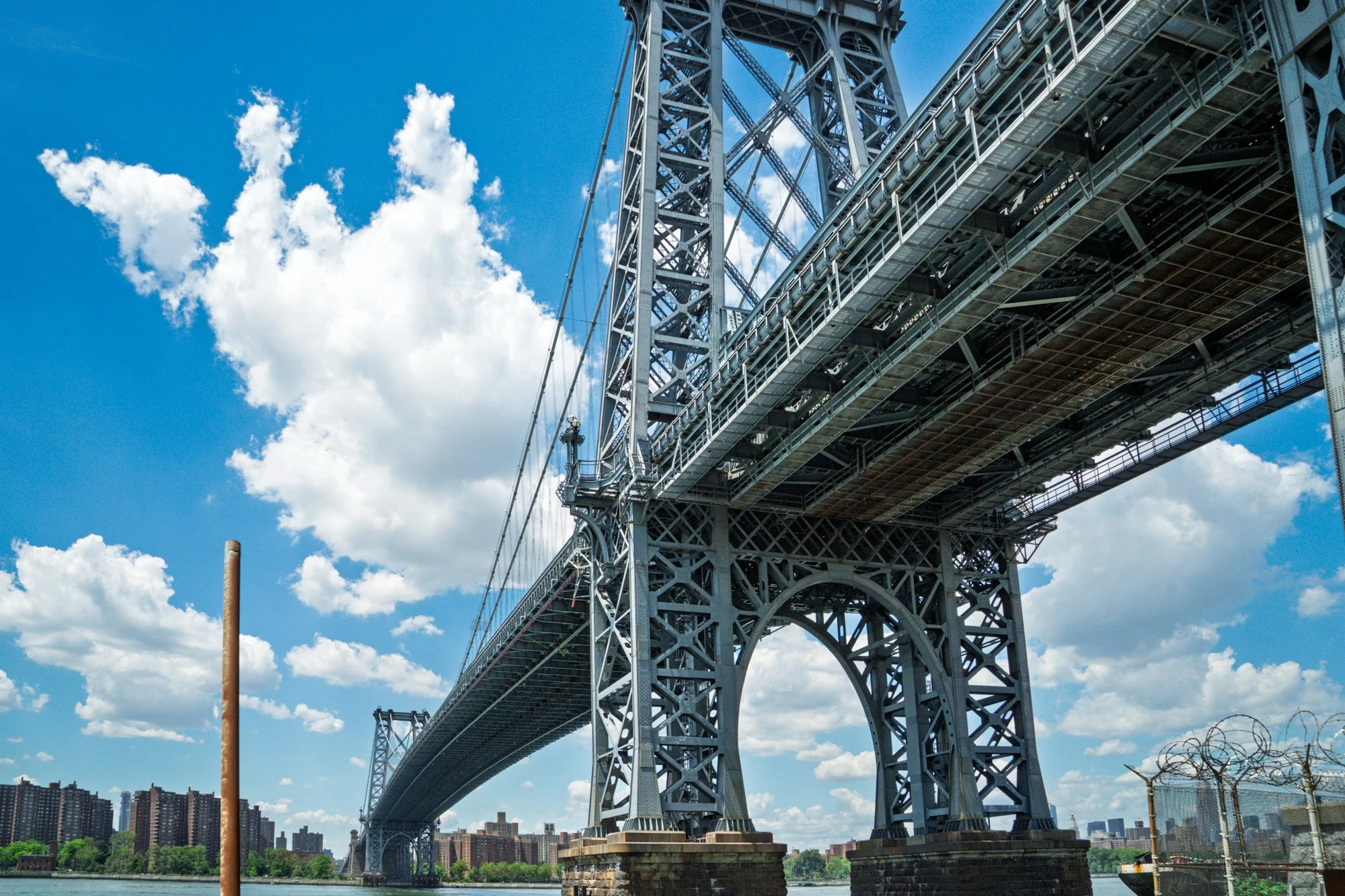Looking up at the underside of the Williamsburg Bridge from the Brooklyn waterfront — Sony a7II