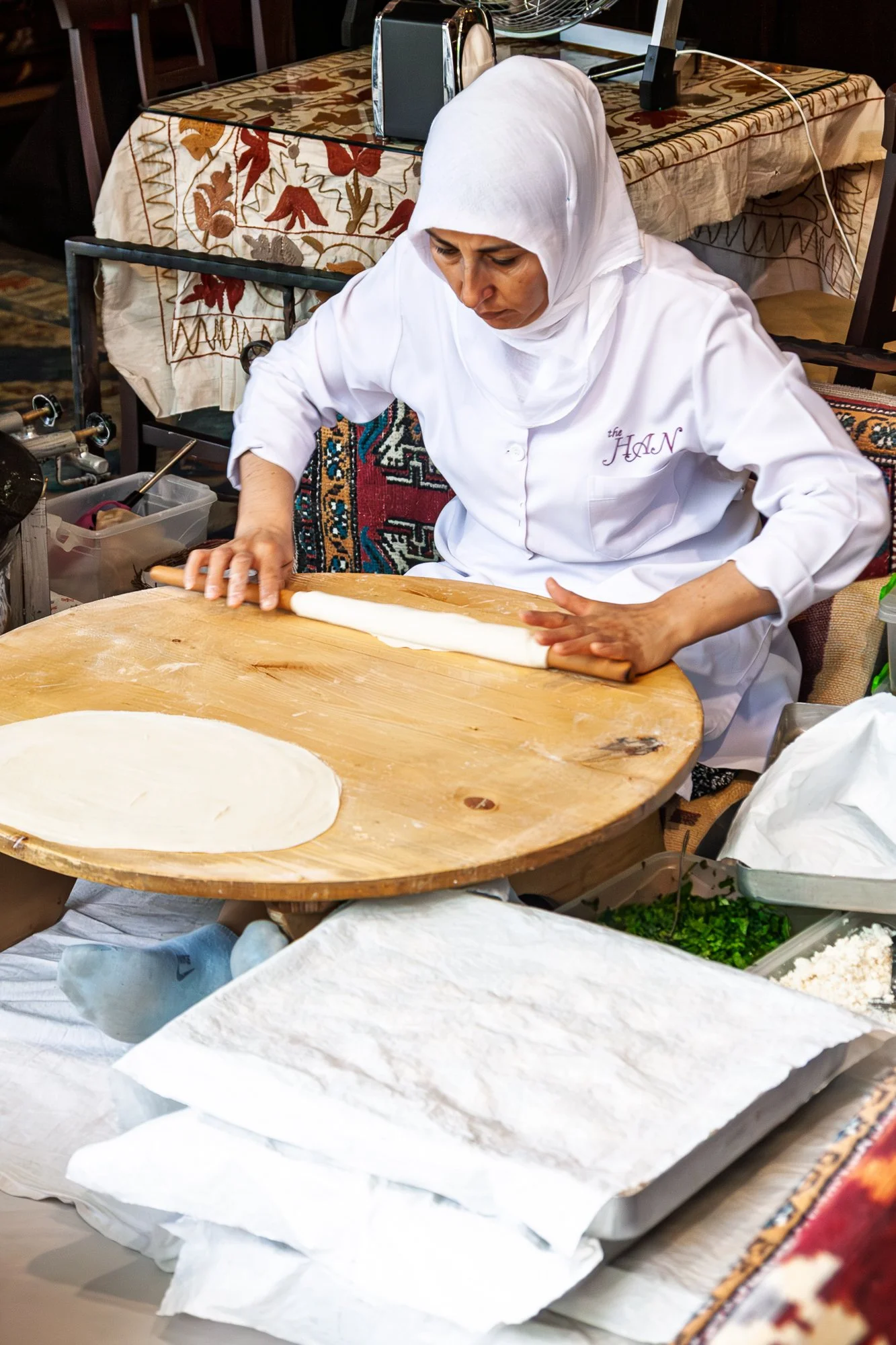 Woman hand-rolling gözleme dough at a street stall, Istanbul — Canon EOS 40D