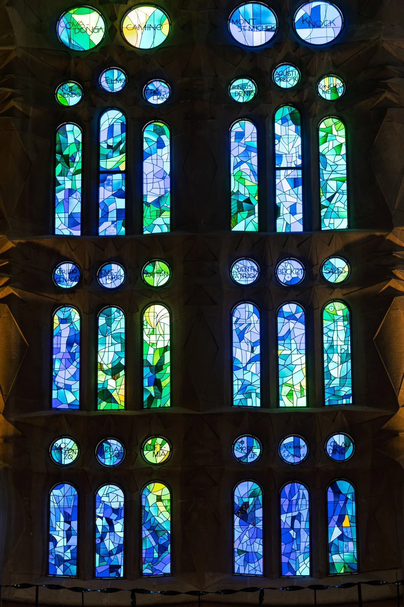 Cool blue and green stained glass wall inside the Sagrada Família — bCLPhoto