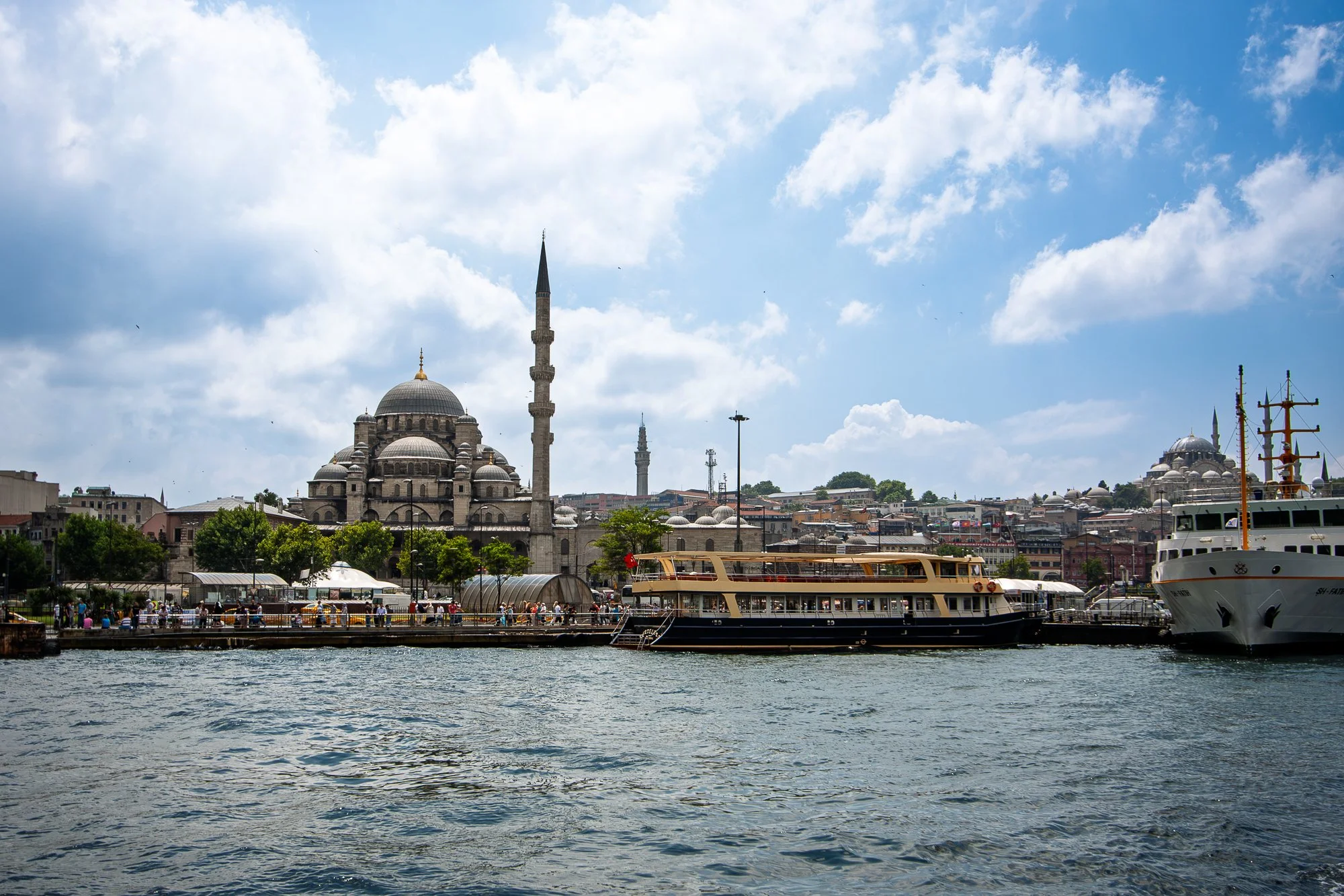 Yeni Camii, the New Mosque, against a blue sky in Istanbul