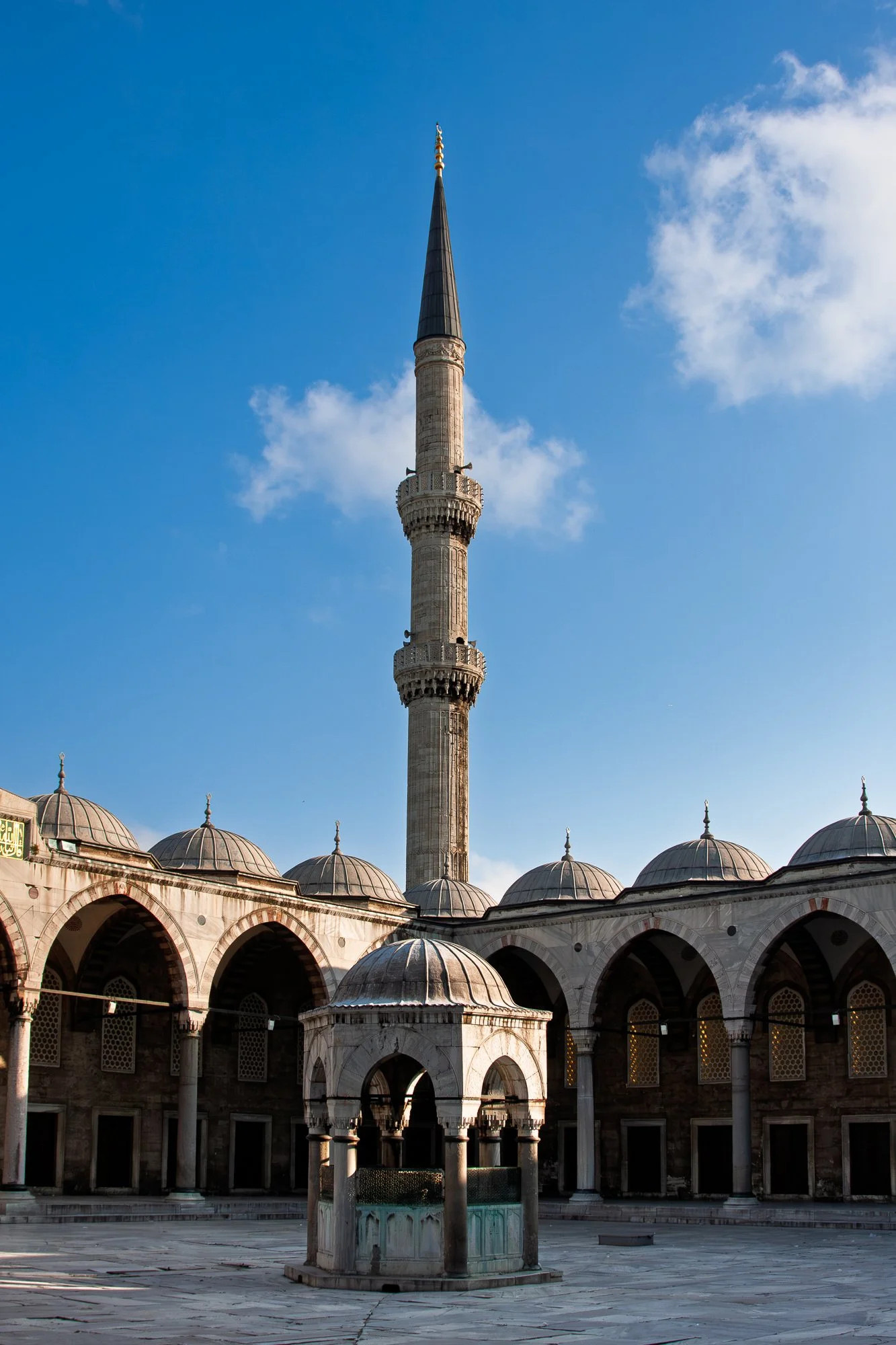 Single minaret of the Blue Mosque against a cloud