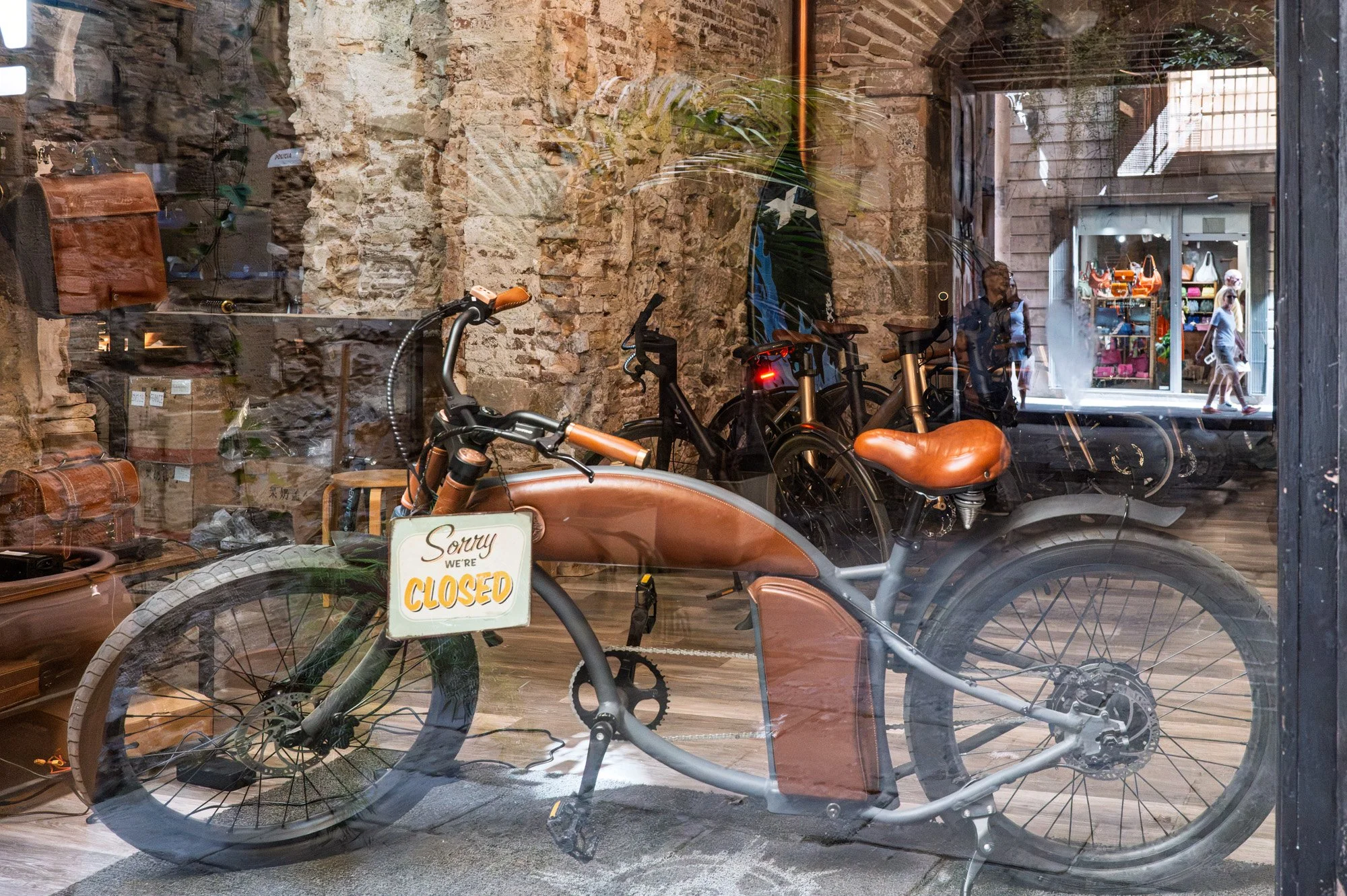 Bicycles reflected in old shop window, El Born Barcelona — Leica Q3
