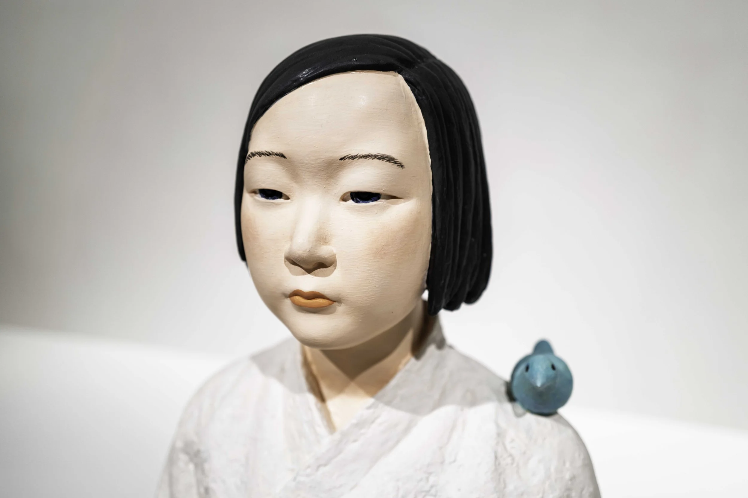 Portrait of the Girl of Peace sculpture with blue bird, Museum of Forbidden Art Barcelona — Leica Q3