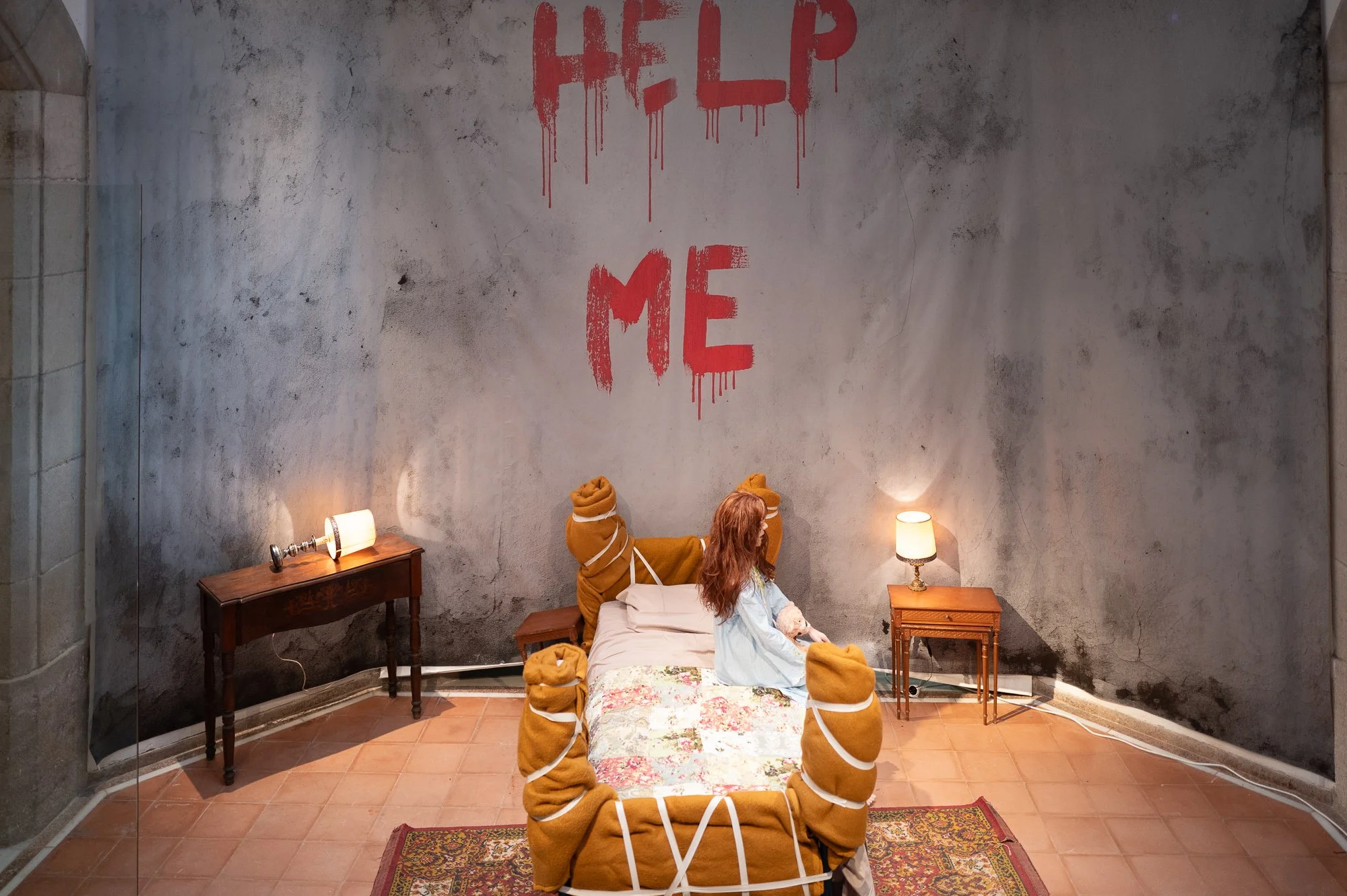 Recreated Exorcist bedroom with HELP ME painted on the wall and a bound bed, Miramar, Sitges — Leica Q3