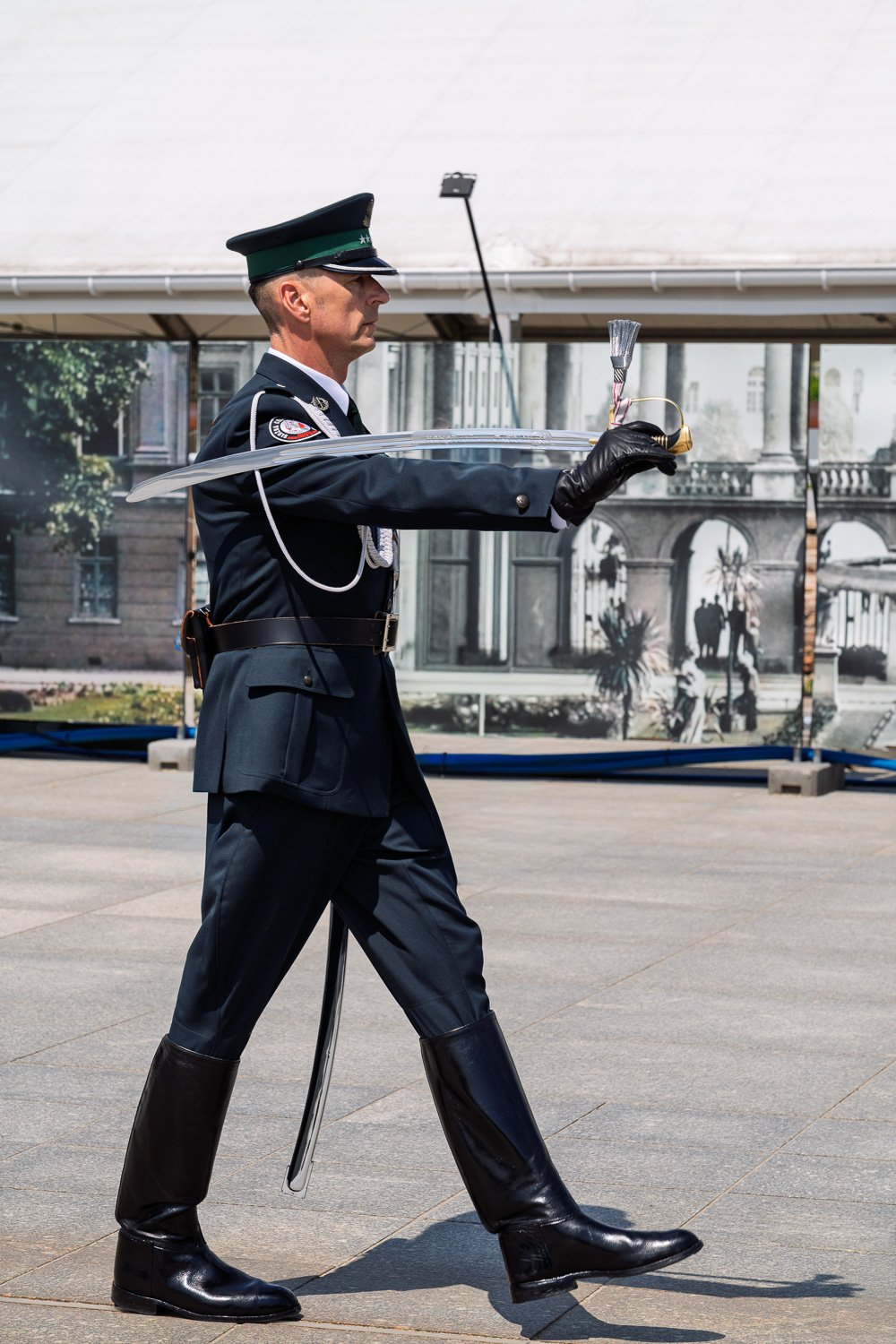 Honour guard officer marching with a sabre before photos of the Saxon Palace, Tomb of the Unknown Soldier — Sony a7R IV