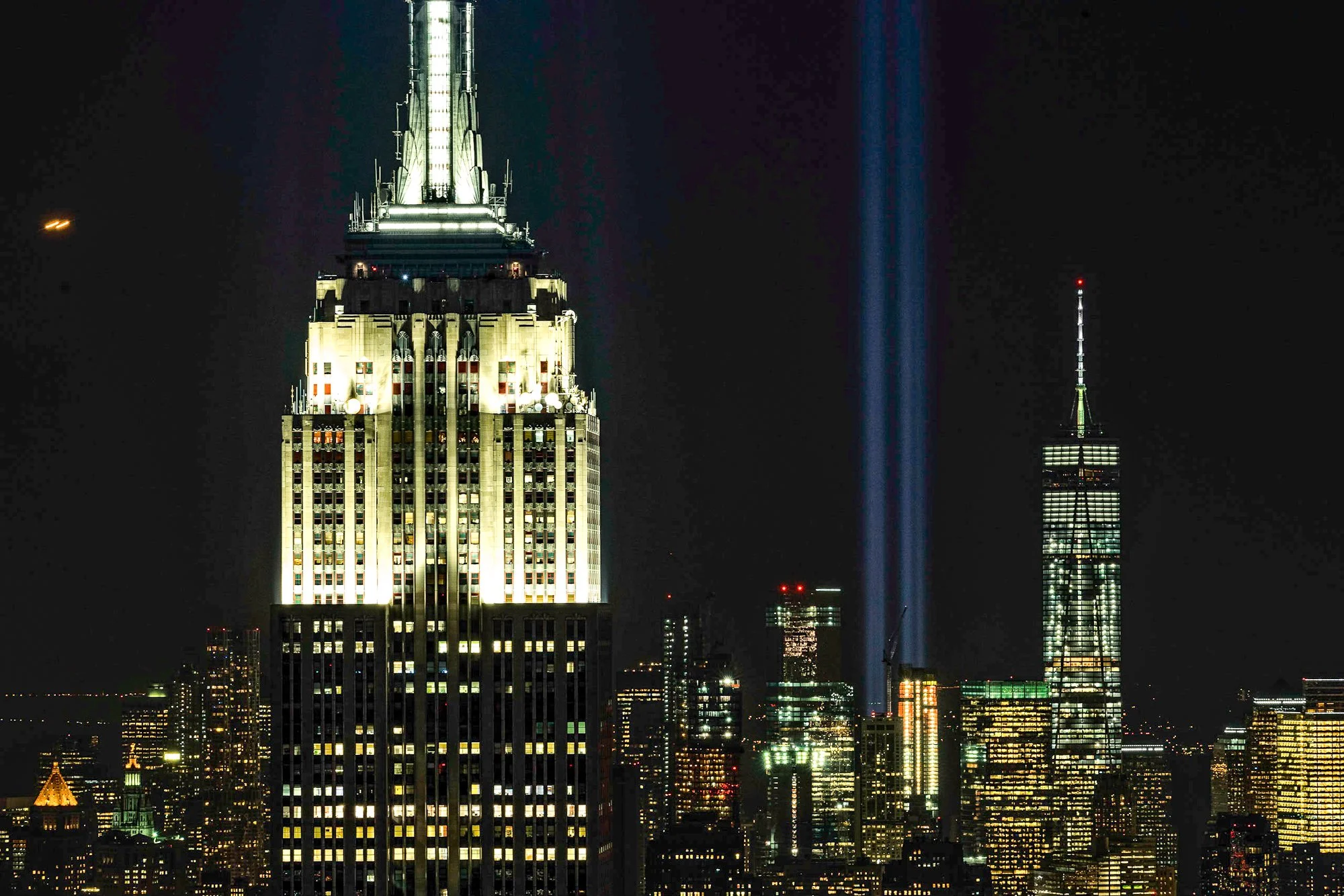 Empire State Building and Tribute in Light beams over Manhattan skyline, New York City — Sony a7 II