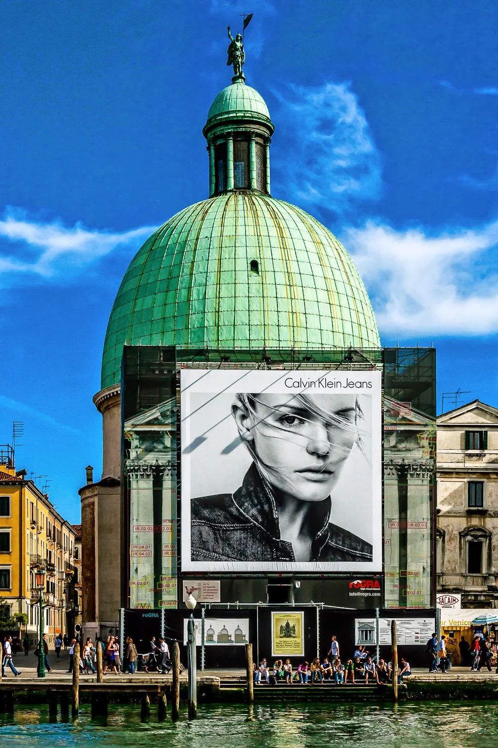 Calvin Klein Jeans billboard covering scaffolding on a church dome along the Grand Canal, Venice — bCLPhoto