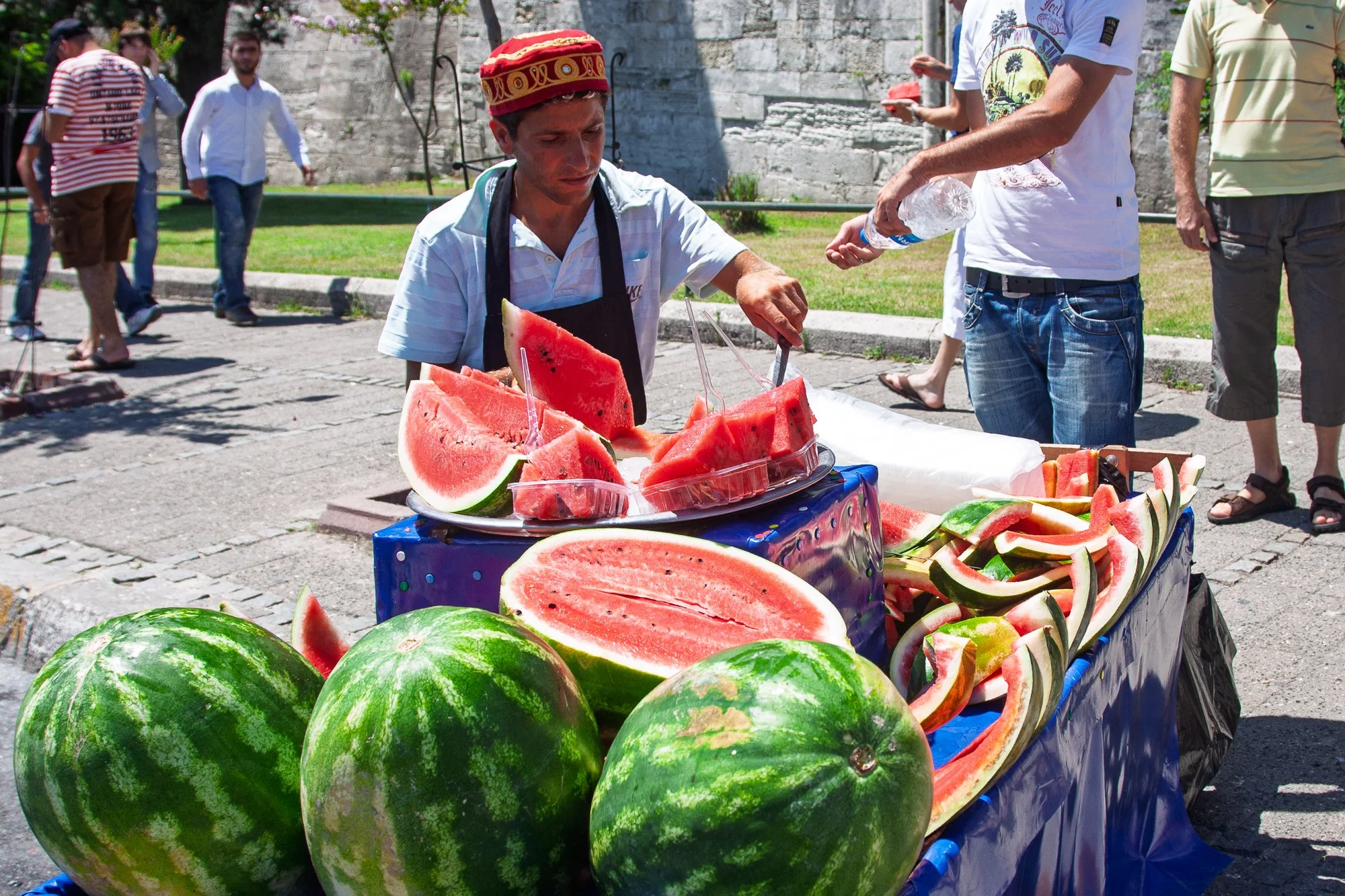 Watermelon vendor in a red fez beside his cart, Istanbul — Canon EOS 40D