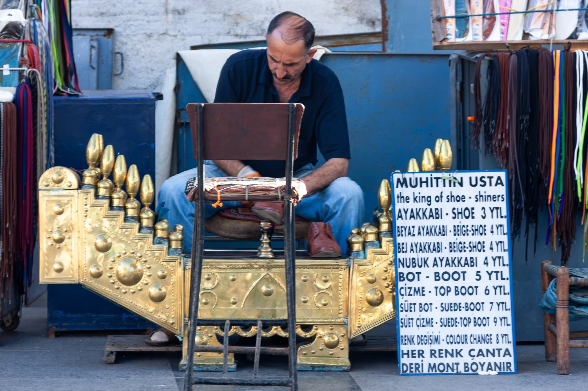 Shoe-shiner Muhittin Usta polishing shoes on an Istanbul street corner — Canon EOS 40D