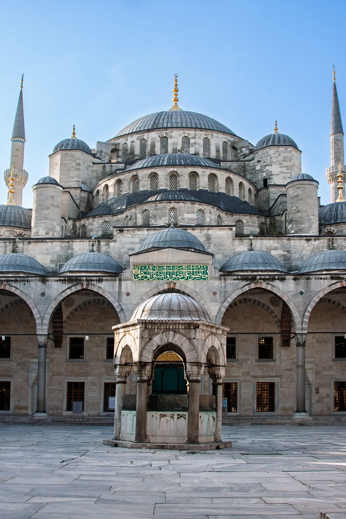 Blue Mosque courtyard ablution fountain beneath the minarets