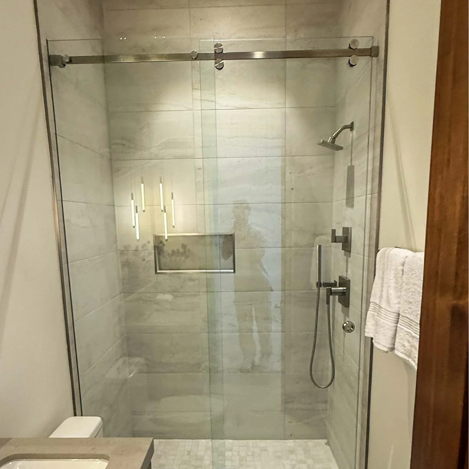What Causes Shower Door Glass to Become Cloudy?