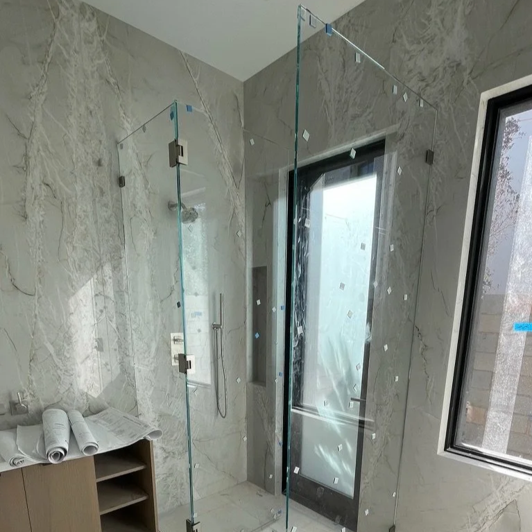Frameless Shower Doors That Highlight Tile and Stone