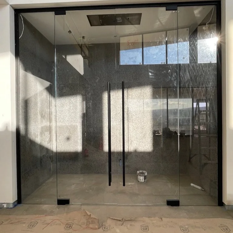 Frameless Glass Doors That Elevate Entryway Aesthetics
