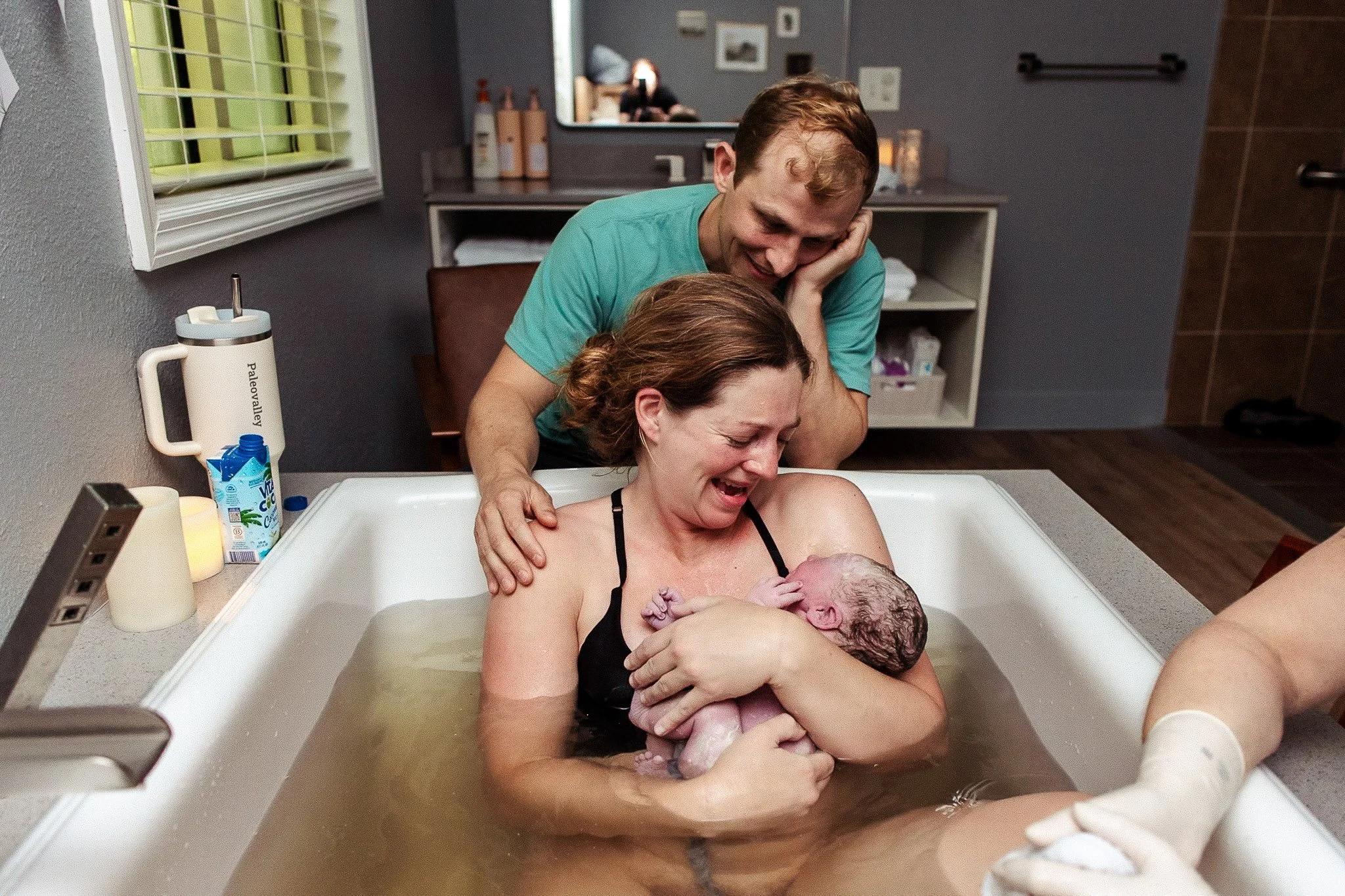Peaceful waterbirth in Cary NC. Witness the gentle arrival of new life with Birth Photography-The Doula Lens