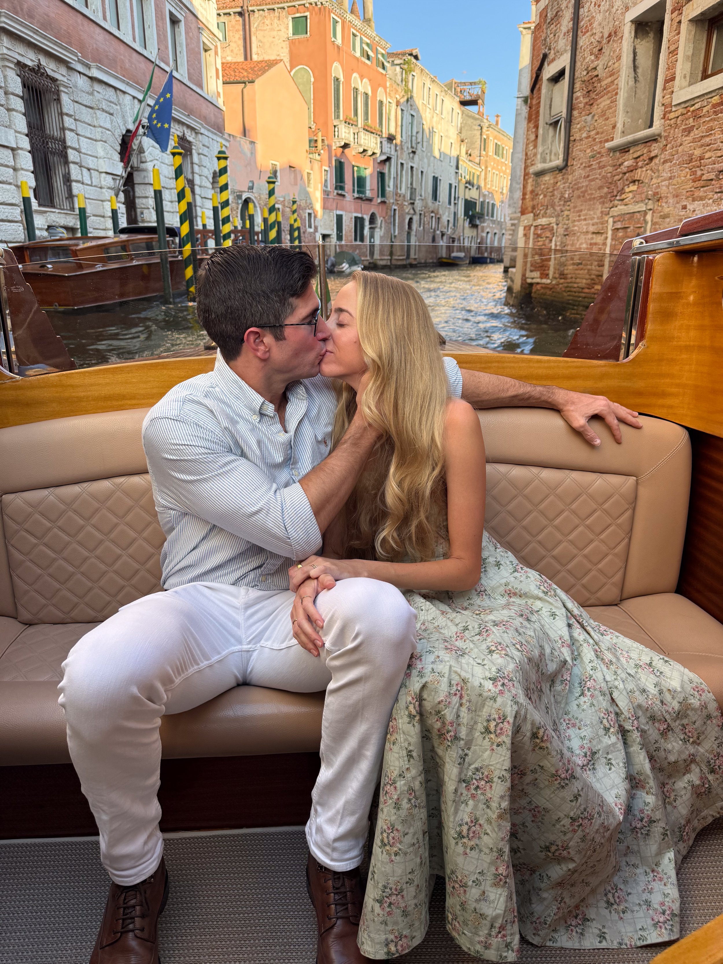 kissing on a private water taxi in venice