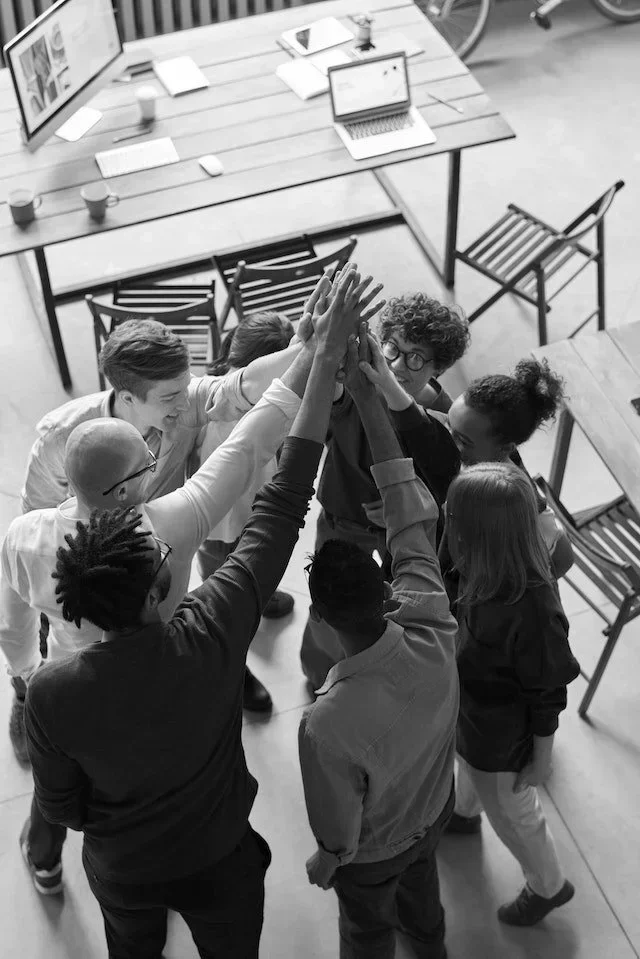 team high fiving together