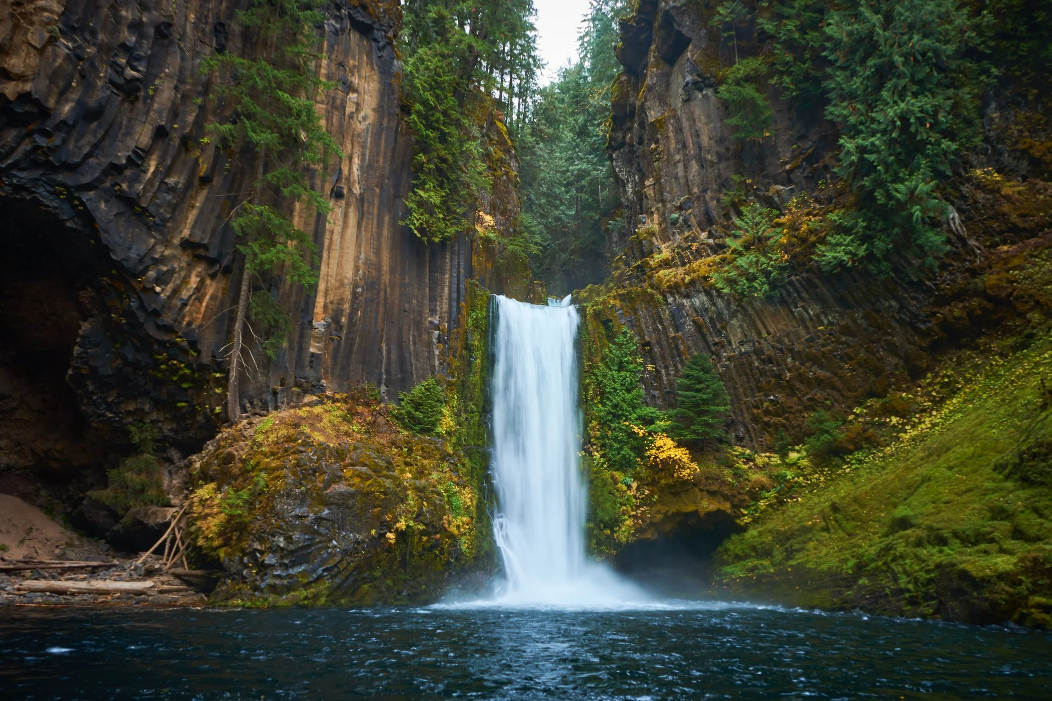 Powerful waterfall flowing through basalt canyon walls in Oregon photographed during a Wake Up To Adventure guided landscape photography tour.