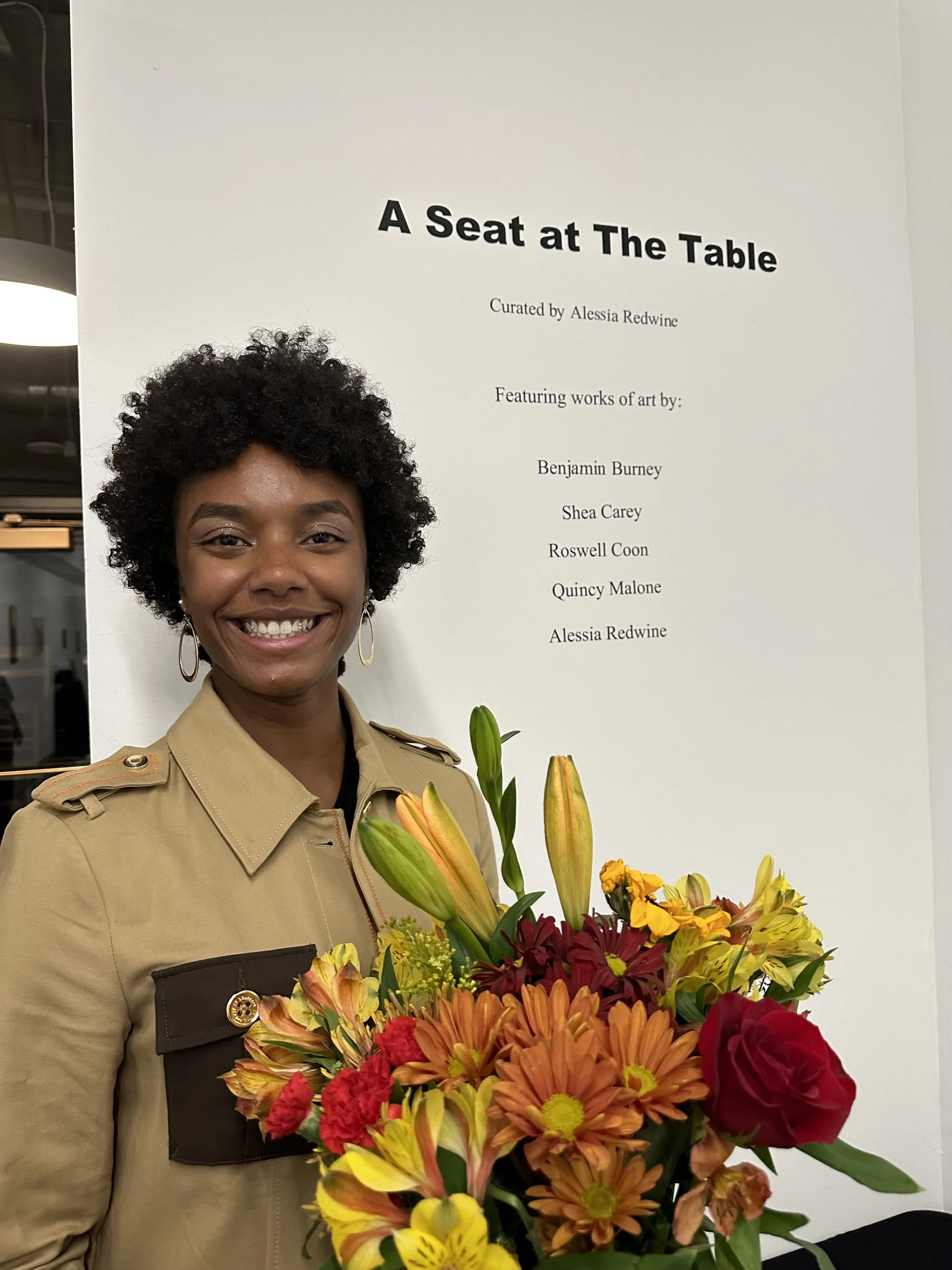Alessia accepting flowers for A Seat at the Table