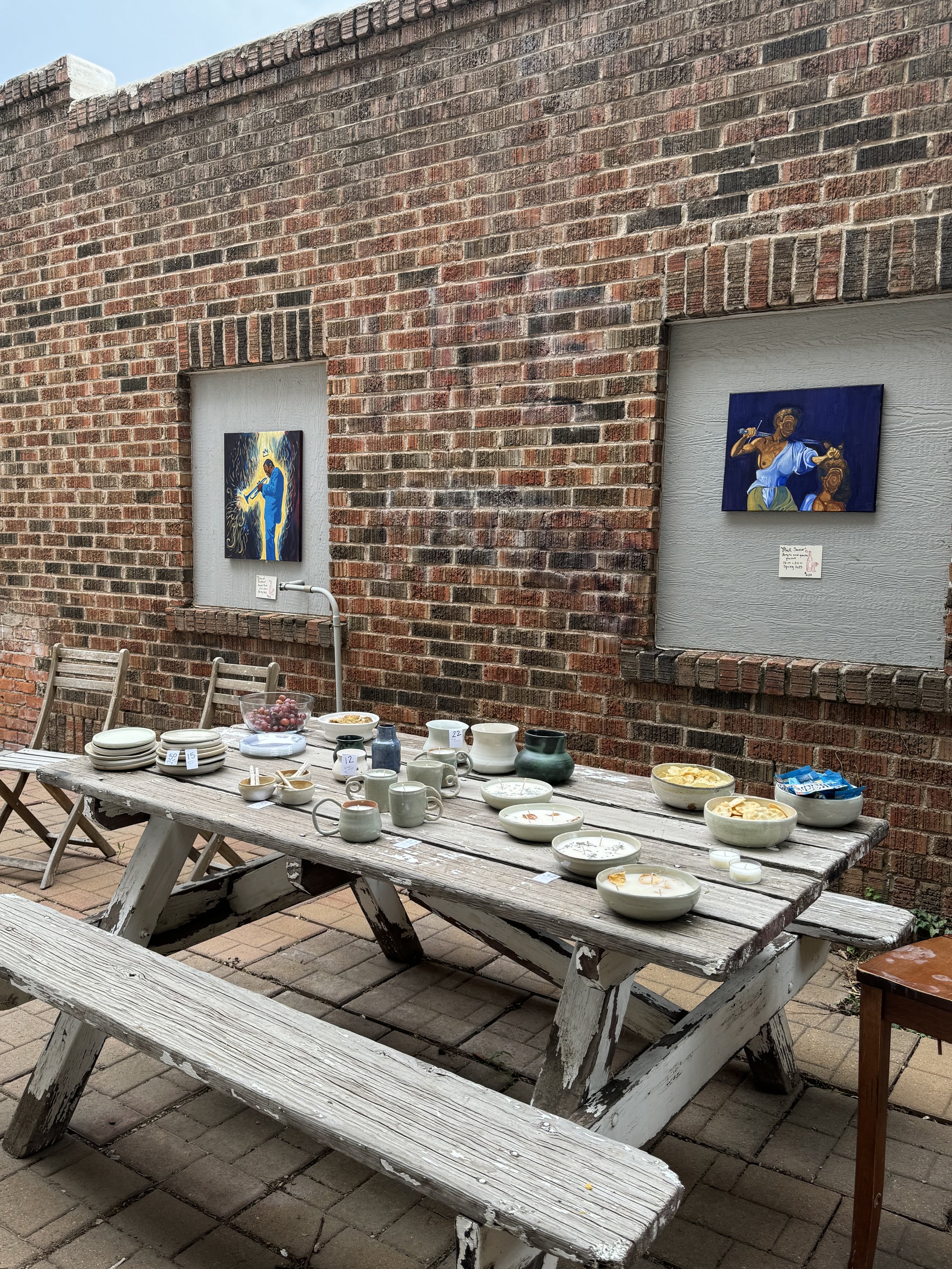 Ceramics and paintings on display outside