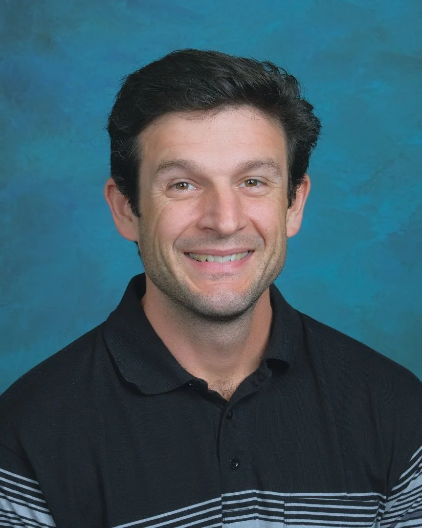 Blue sign with yellow curved lines, displaying the text 'Pathway Staff' in white, bold font